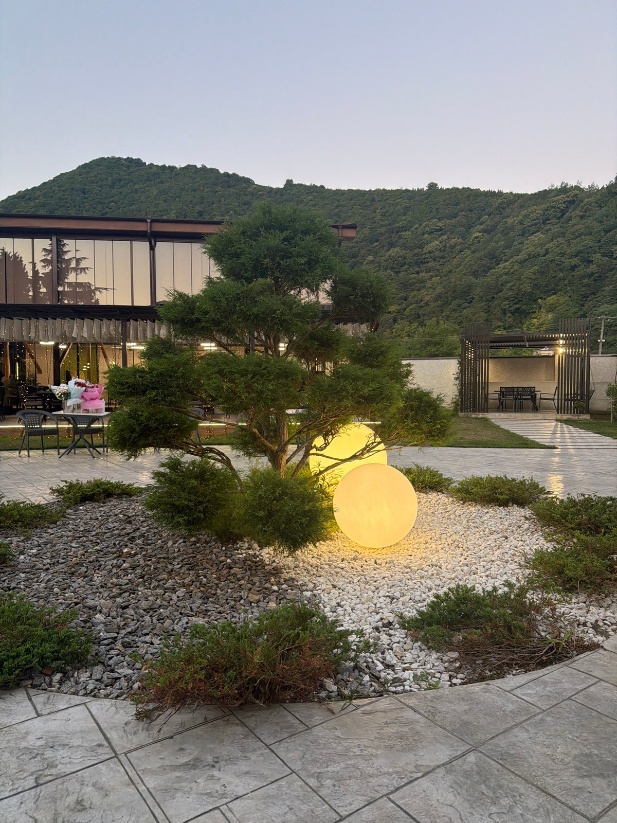 Evening gathering at a lit modern venue in Achadara, Abkhazia