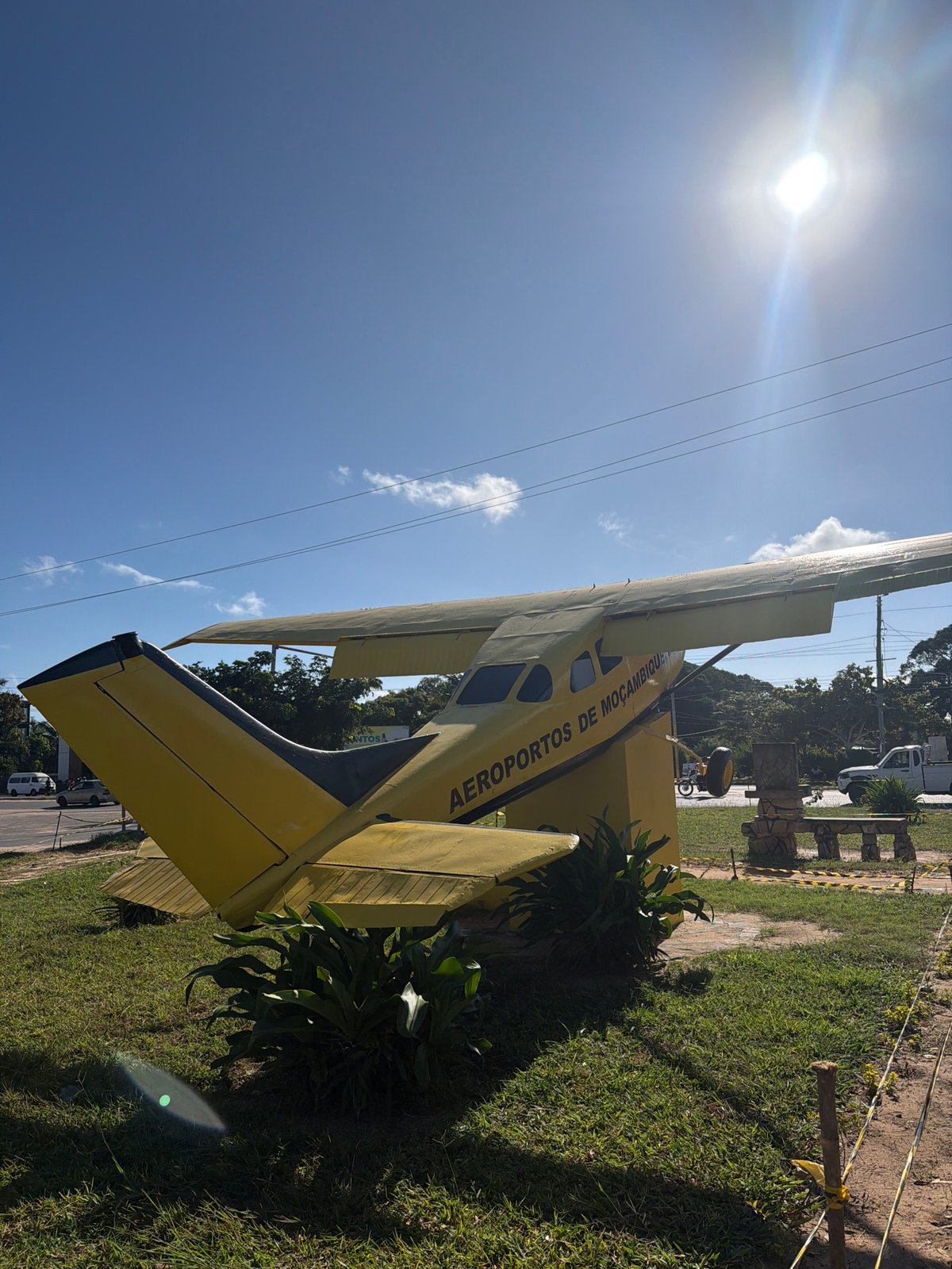 Yellow biplane display documented alongside food scenes during morning hours