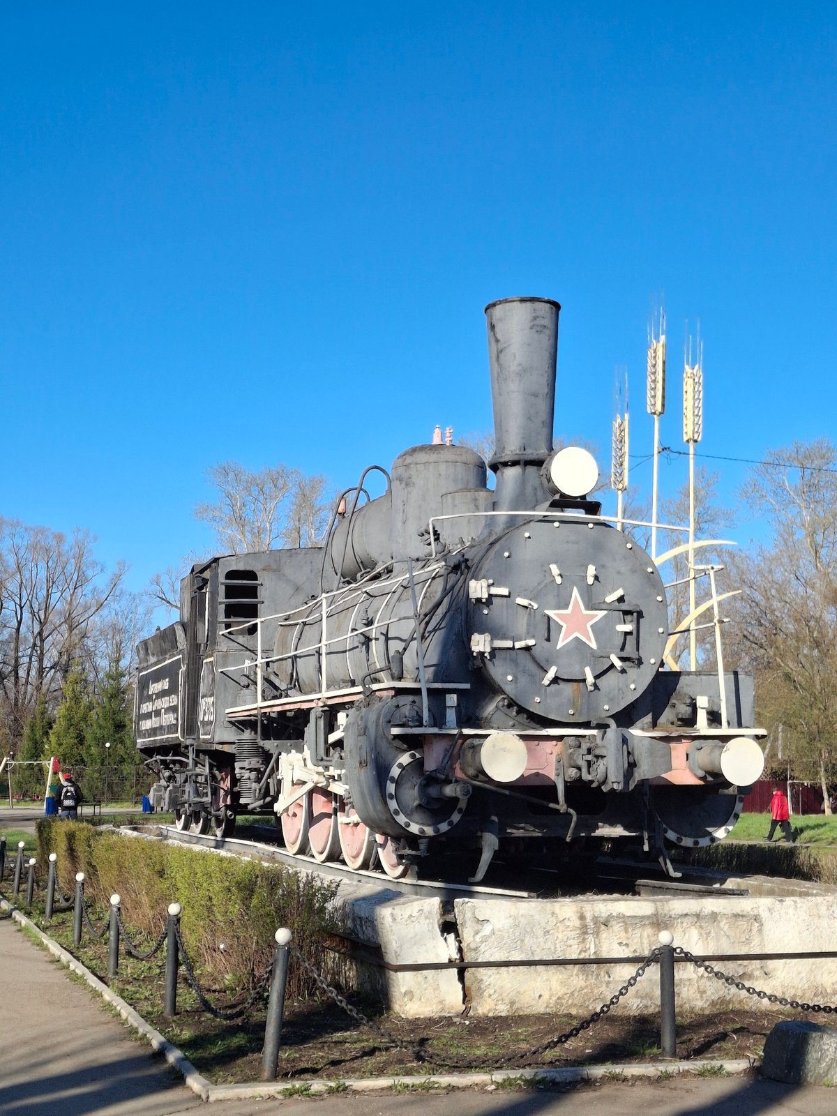 Woman visits historic locomotive monument in Sarapul, Russia