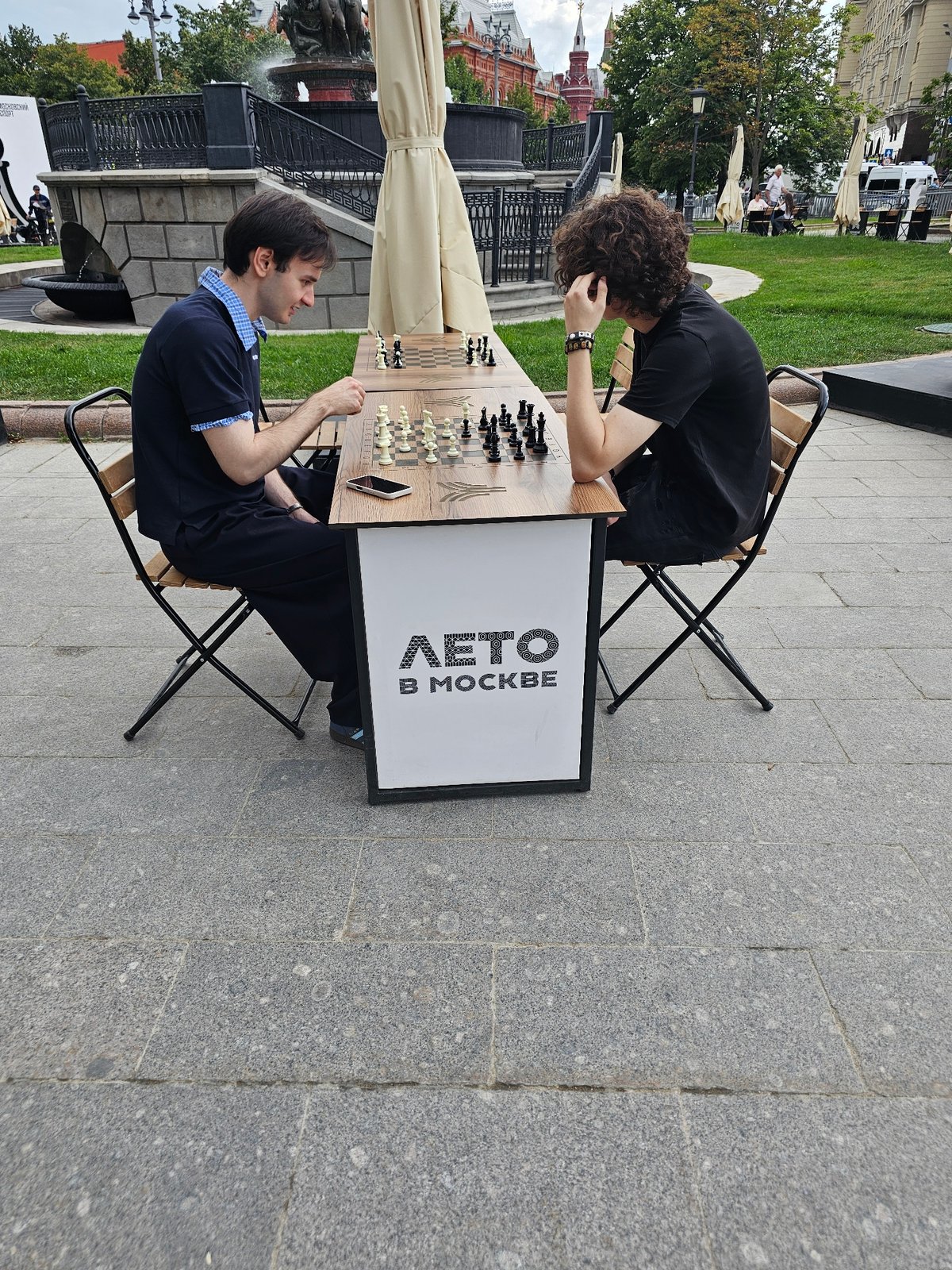 Casual outdoor chess game in Moscow on a summer afternoon