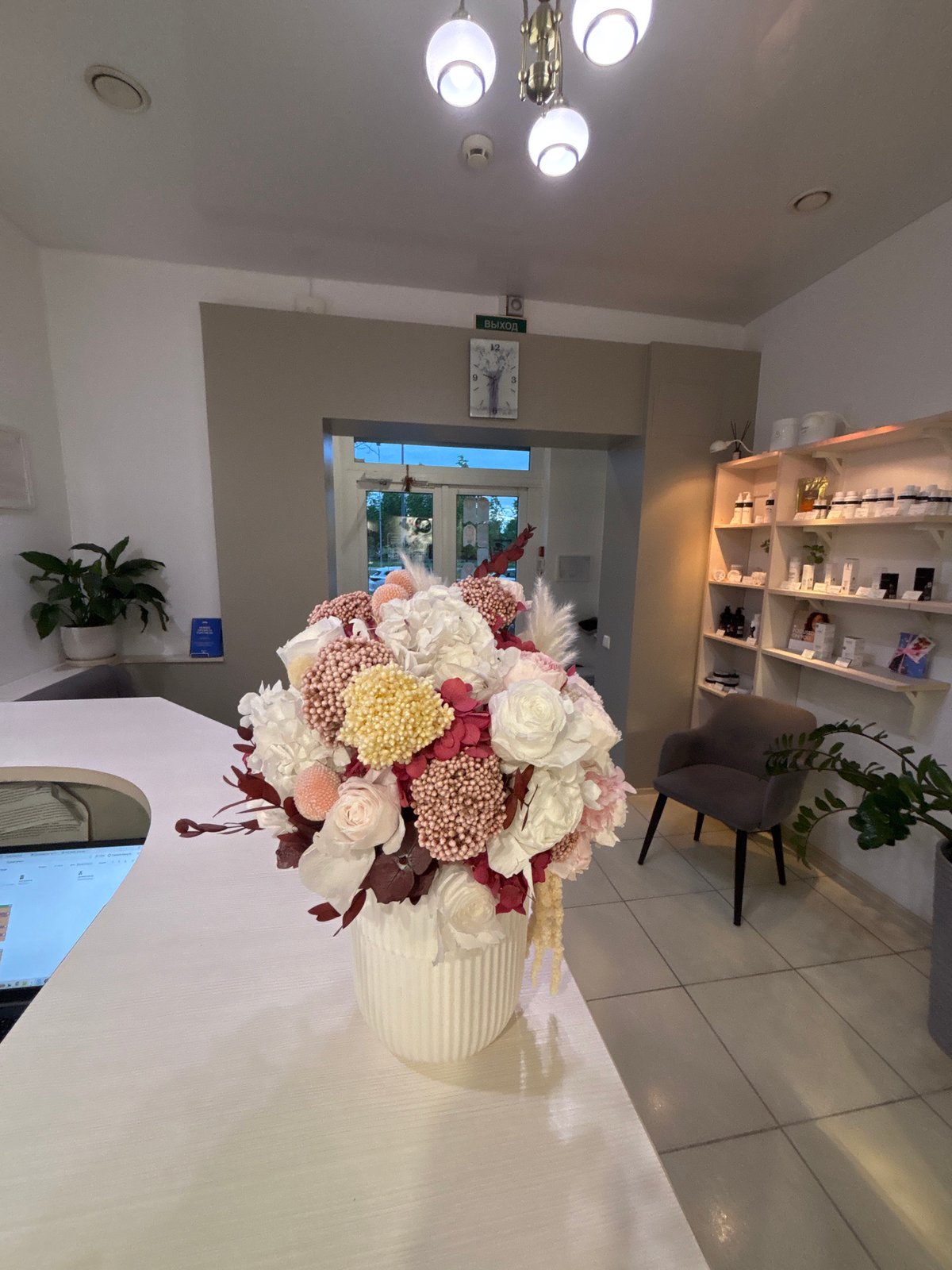 Floral arrangement observed in modern lobby reception area