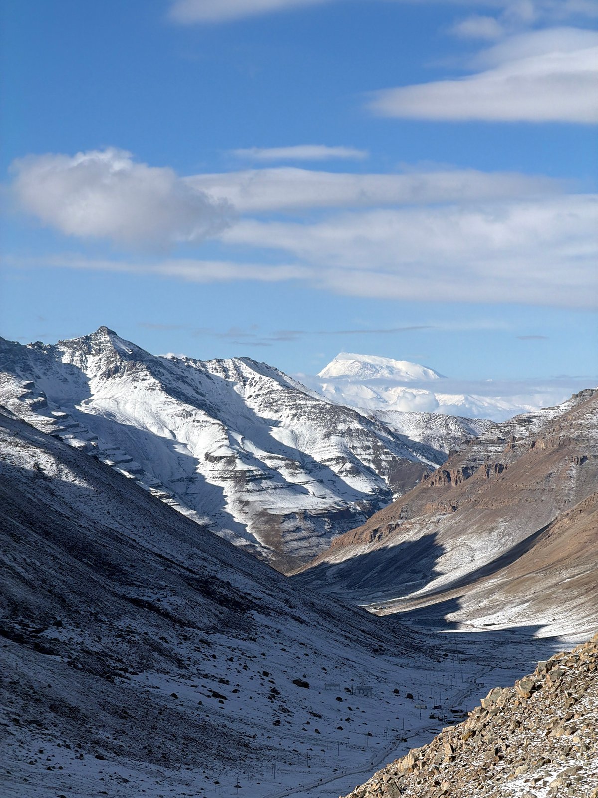 Snow-covered mountain peaks observed under clear skies in China