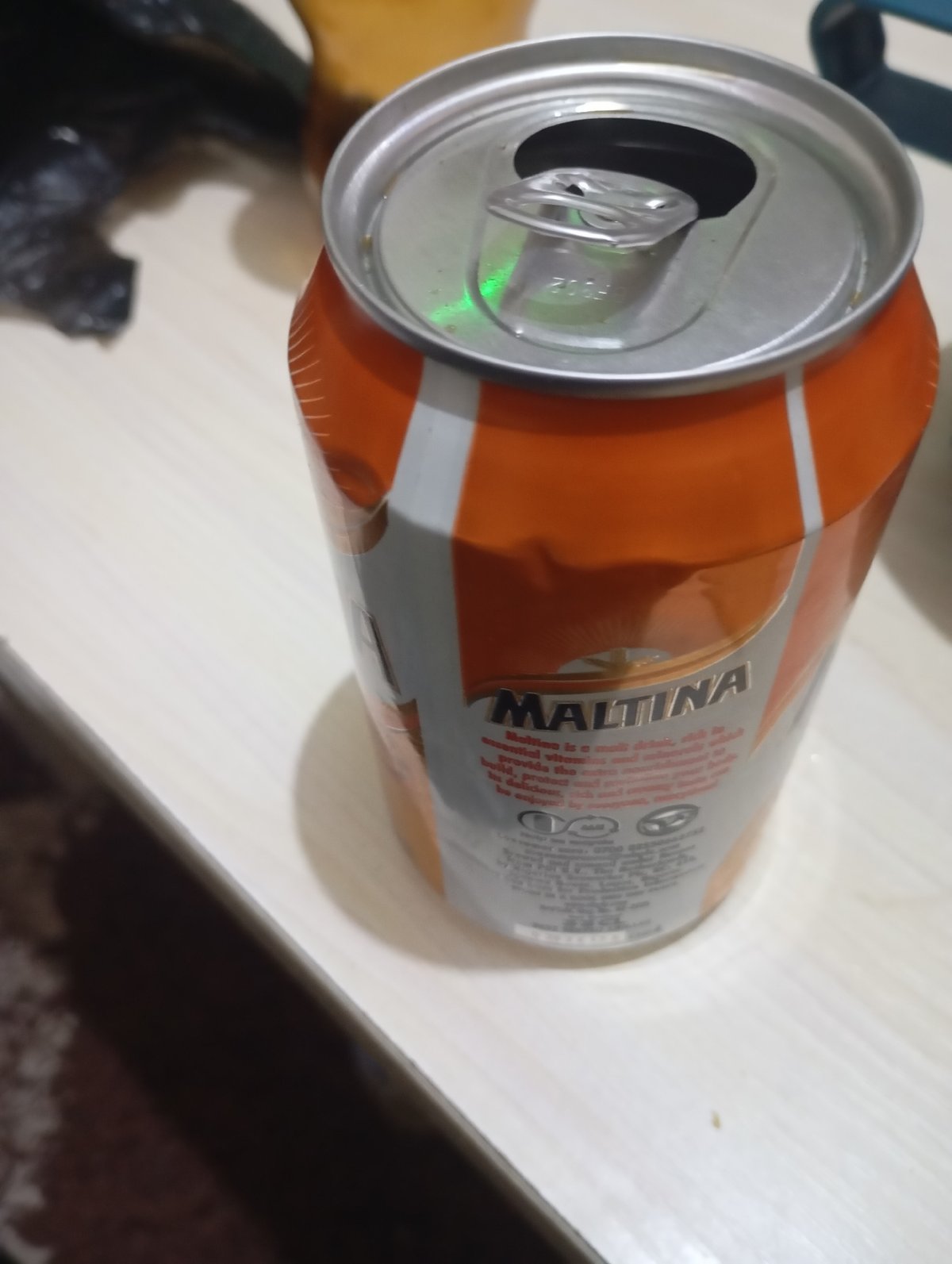 Chilling at home with a Maltina and good vibes