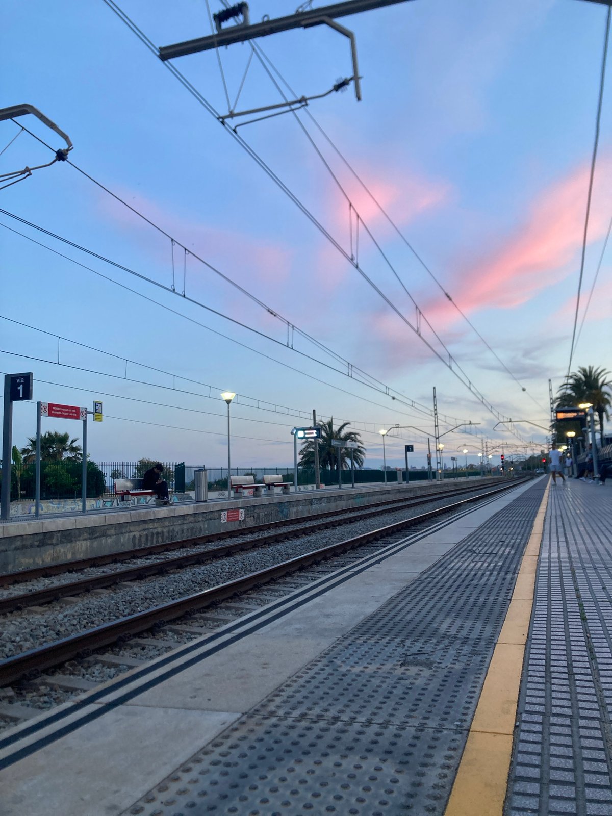 Train platform observed at dusk in Montgat, Spain