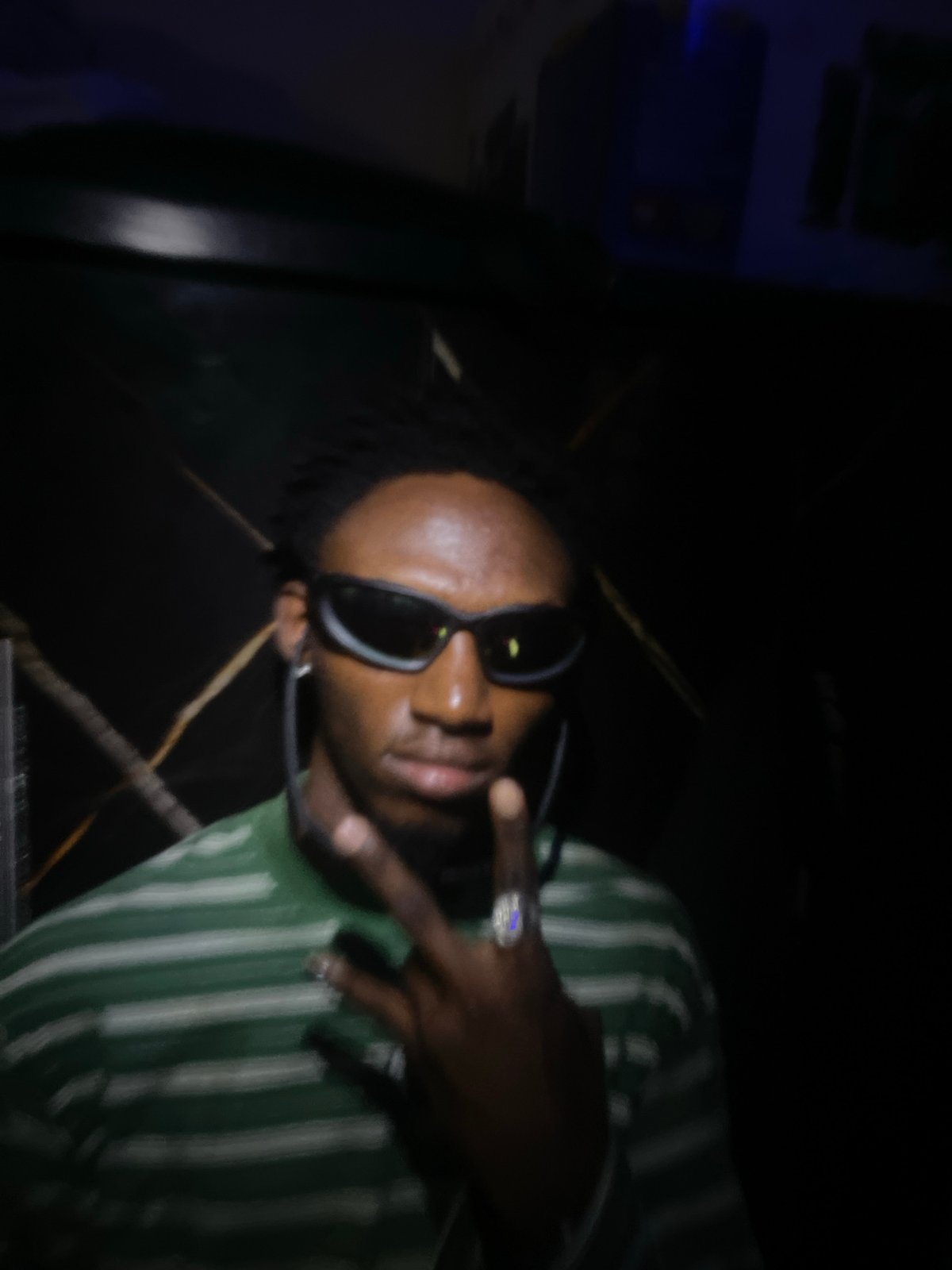 Person documents themselves with jewelry and gestures in Lokoja
