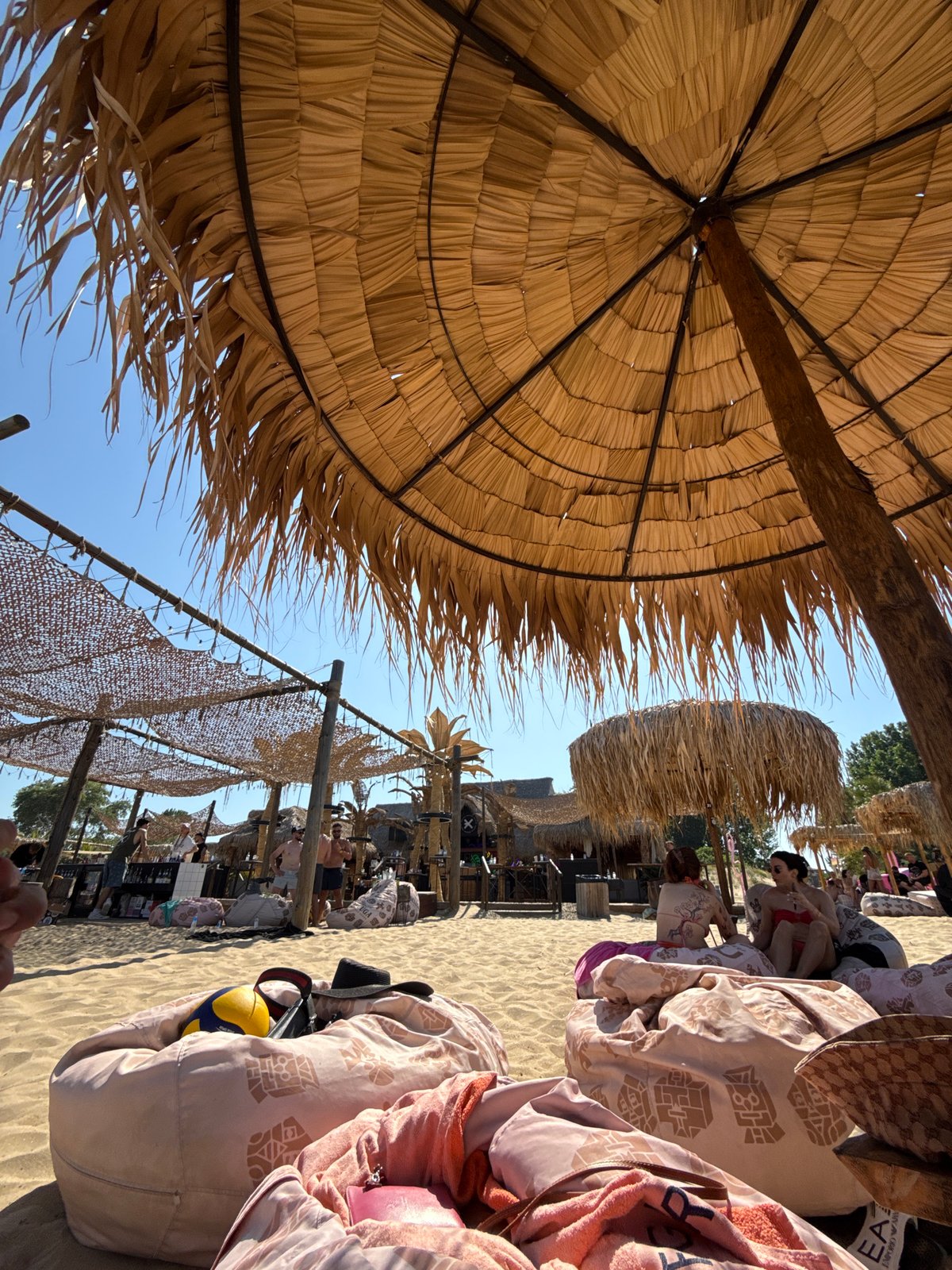 Beanbags and straw umbrellas on a Sozopol beach