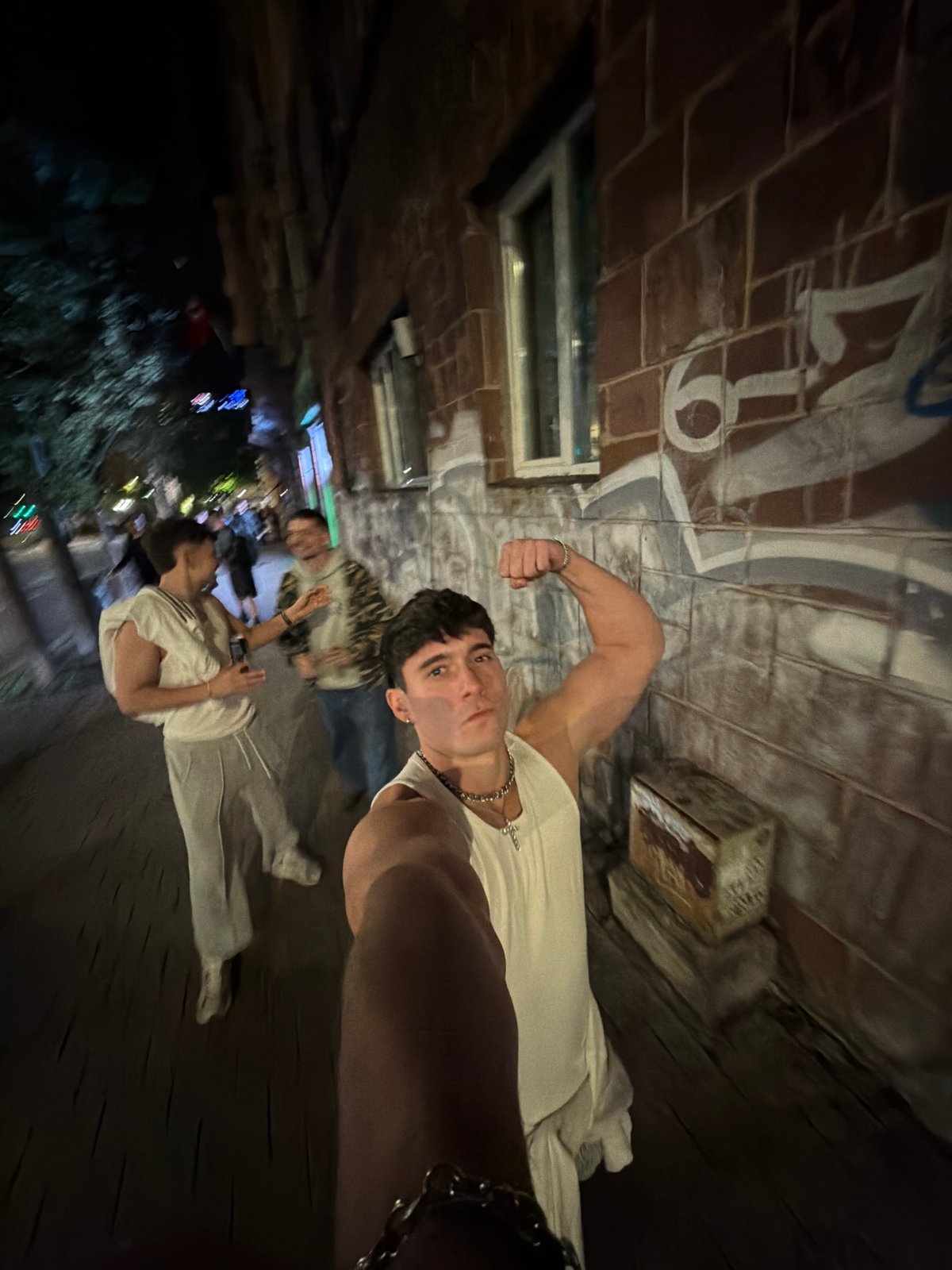 Young men pose for photos outside Sofia nightlife venue