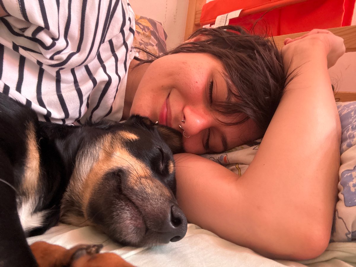 Person and dog sleep peacefully together in Sofia home