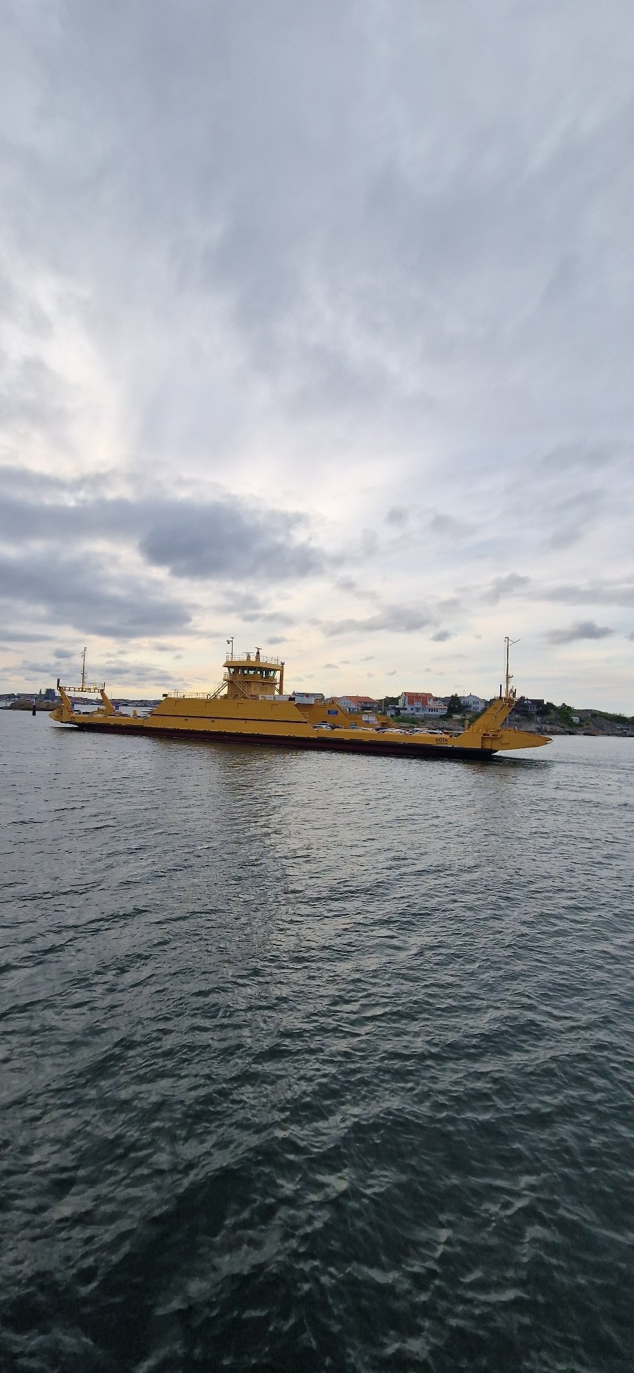 Yellow car ferry GOTA on the water near Öckerö, Sweden