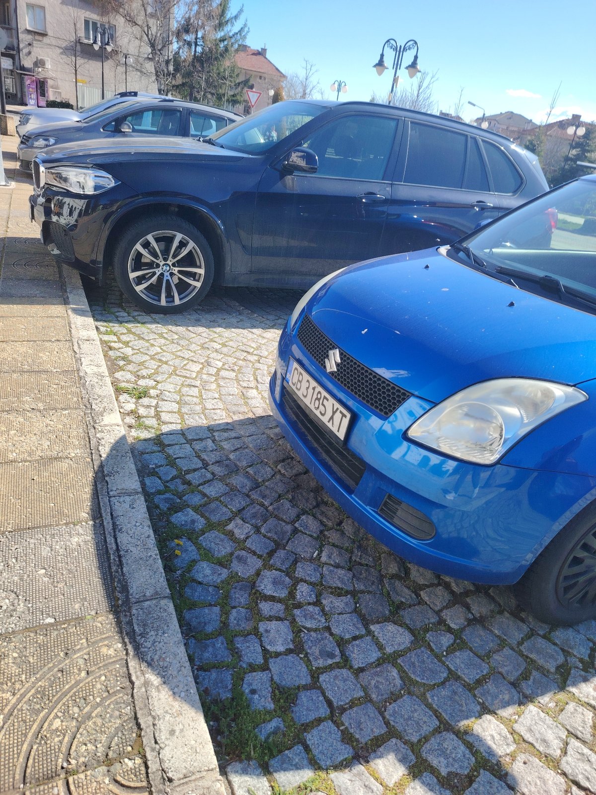 Blue Suzuki Swift spotted parked in Panagyurishte street scene