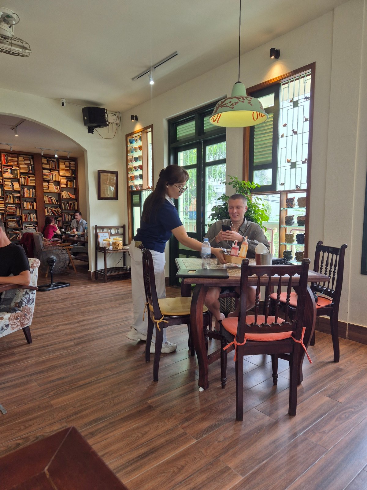 Lazy breakfast morning at a Da Nang cafe with food and coloring books