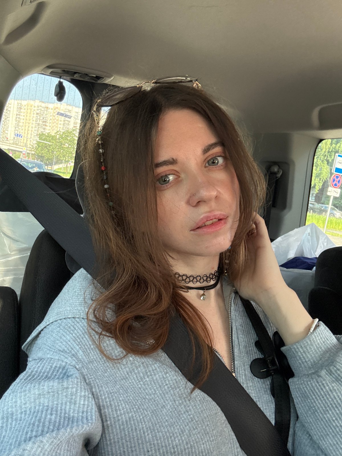 Woman passenger travels through Moscow in early morning traffic