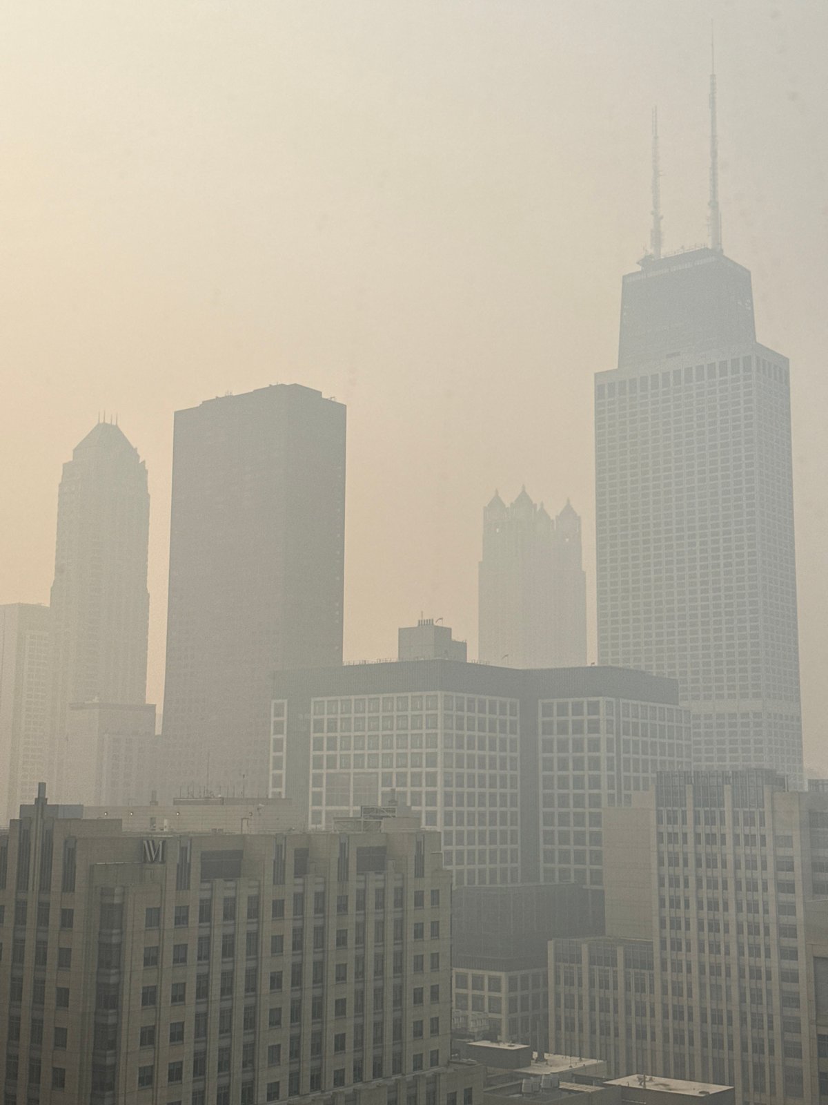 Heavy haze hangs over Chicago's downtown skyline