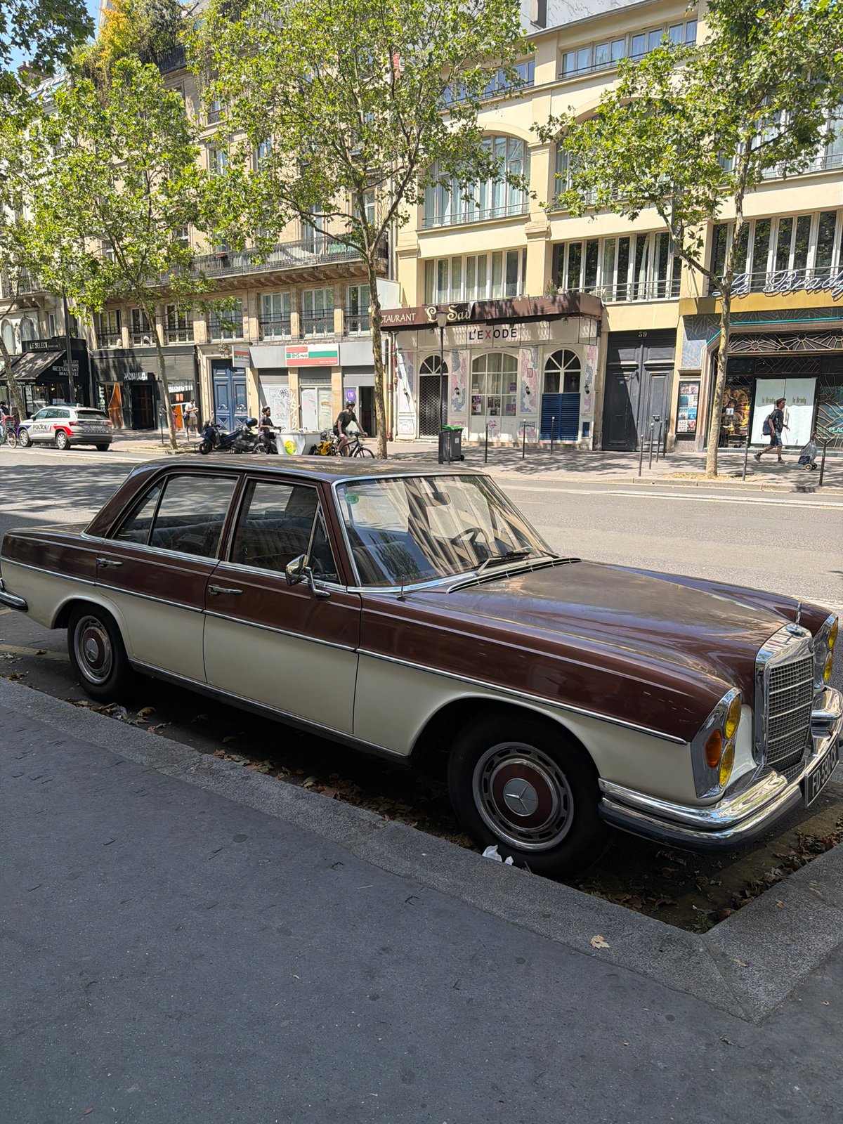 Two-tone Mercedes parked on a Paris street