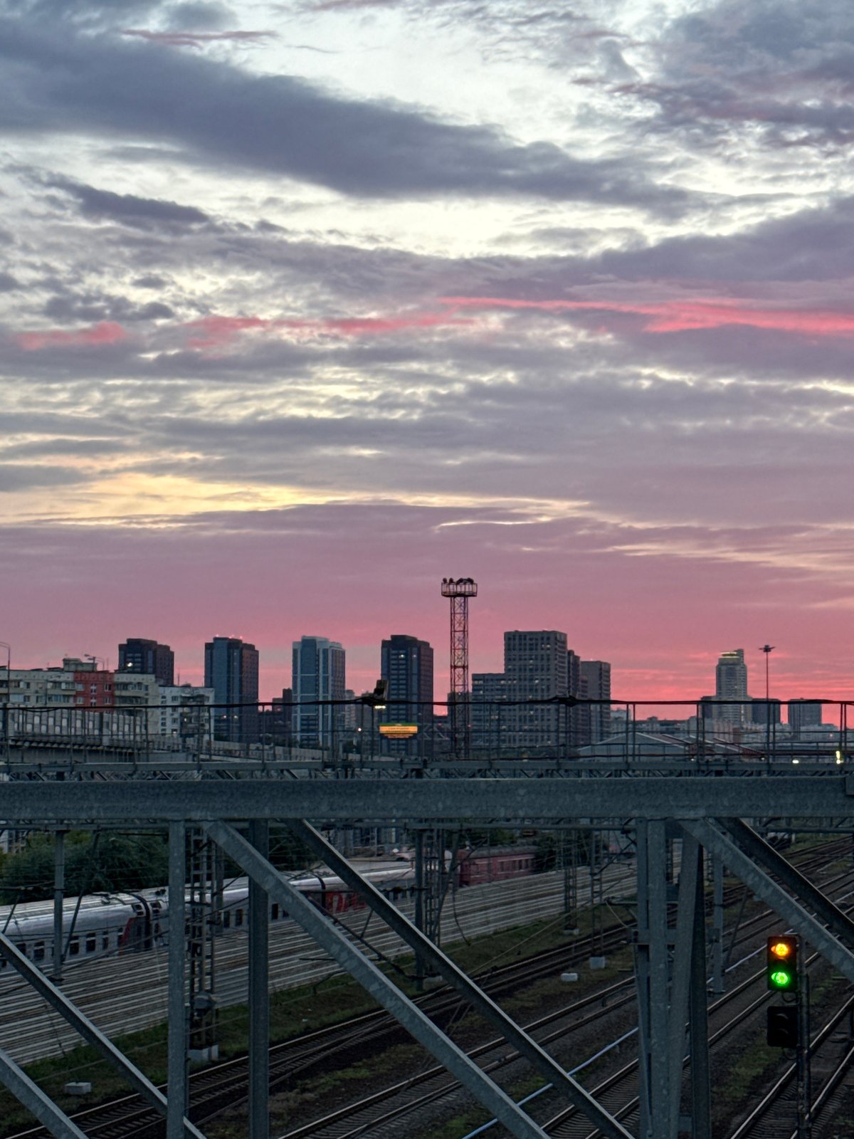 Dusk over a Moscow railyard, shot from a pedestrian overpass