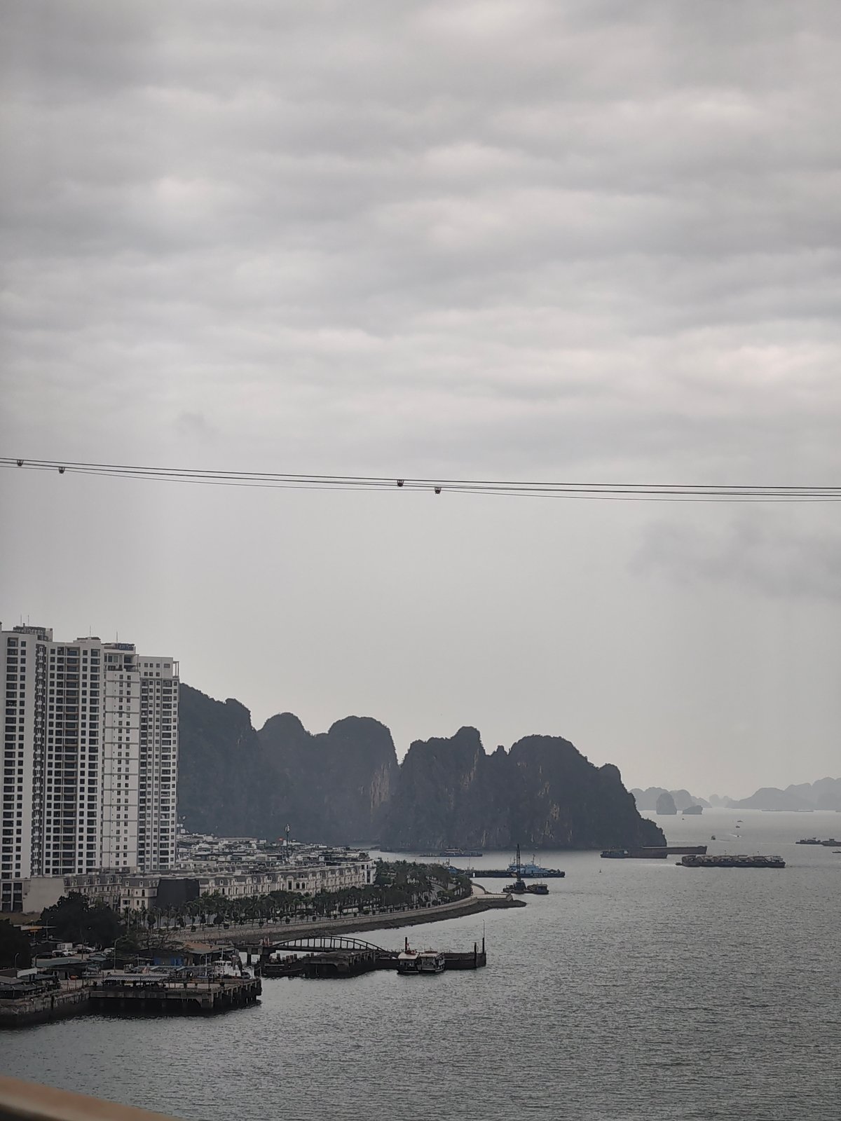 Overcast morning view captures Ha Long Bay coastal development