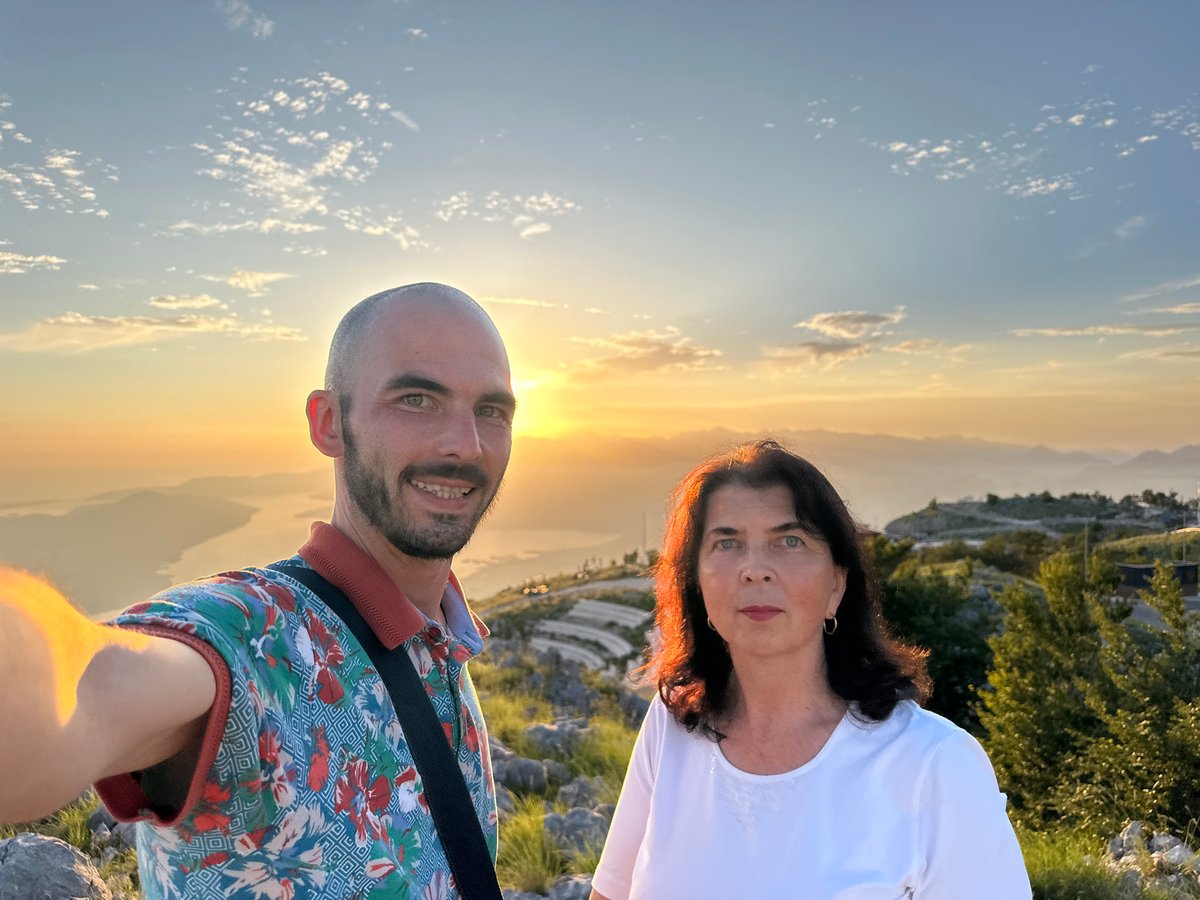 Couple captures sunset selfies on Montenegro mountainside overlook