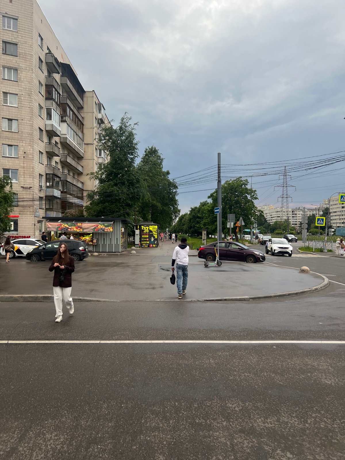 Urban street captured after rainfall on overcast evening