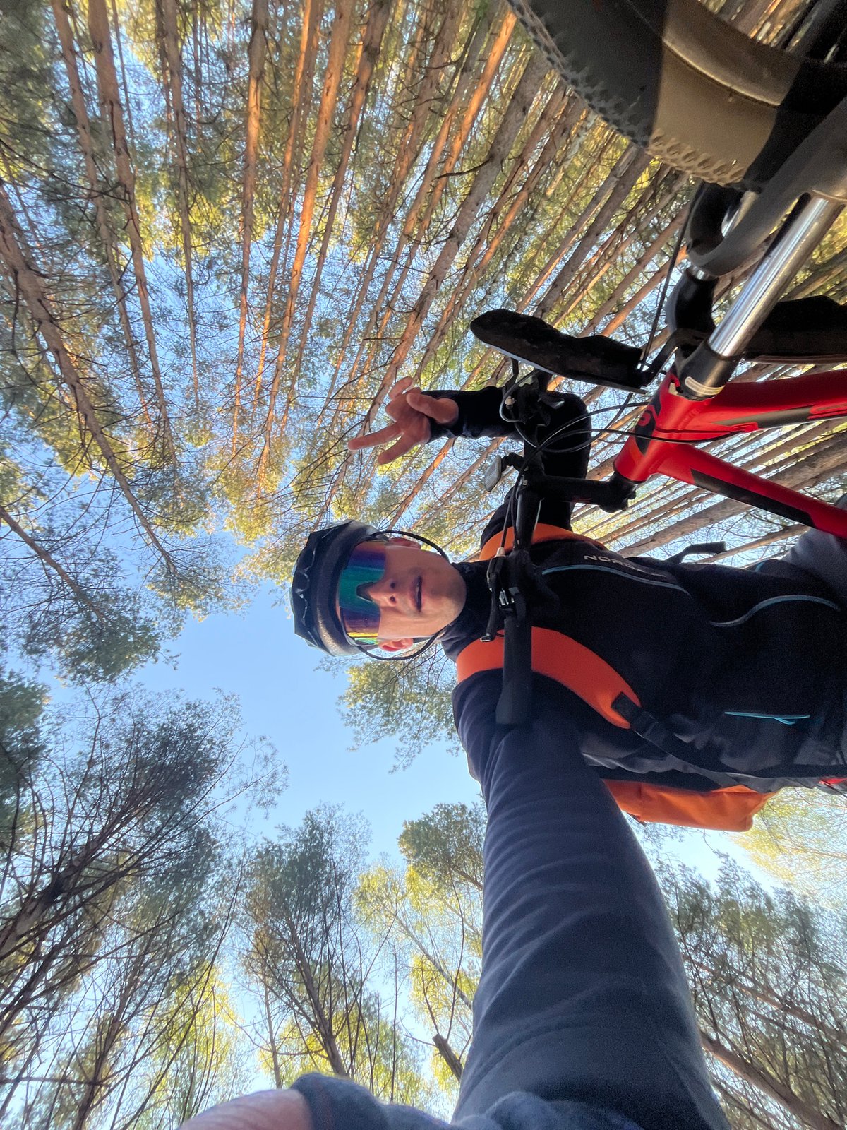 Cyclist poses upside down with mountain bike in Chaikovsky