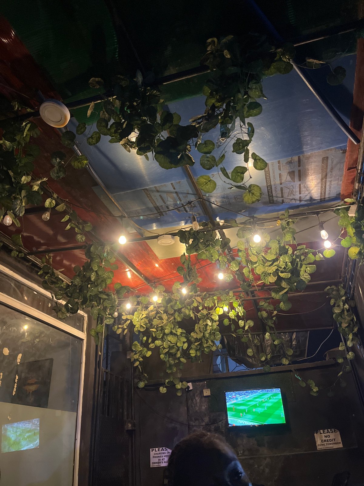 Evening dining and soccer viewing captured in Rumuepirikom establishment