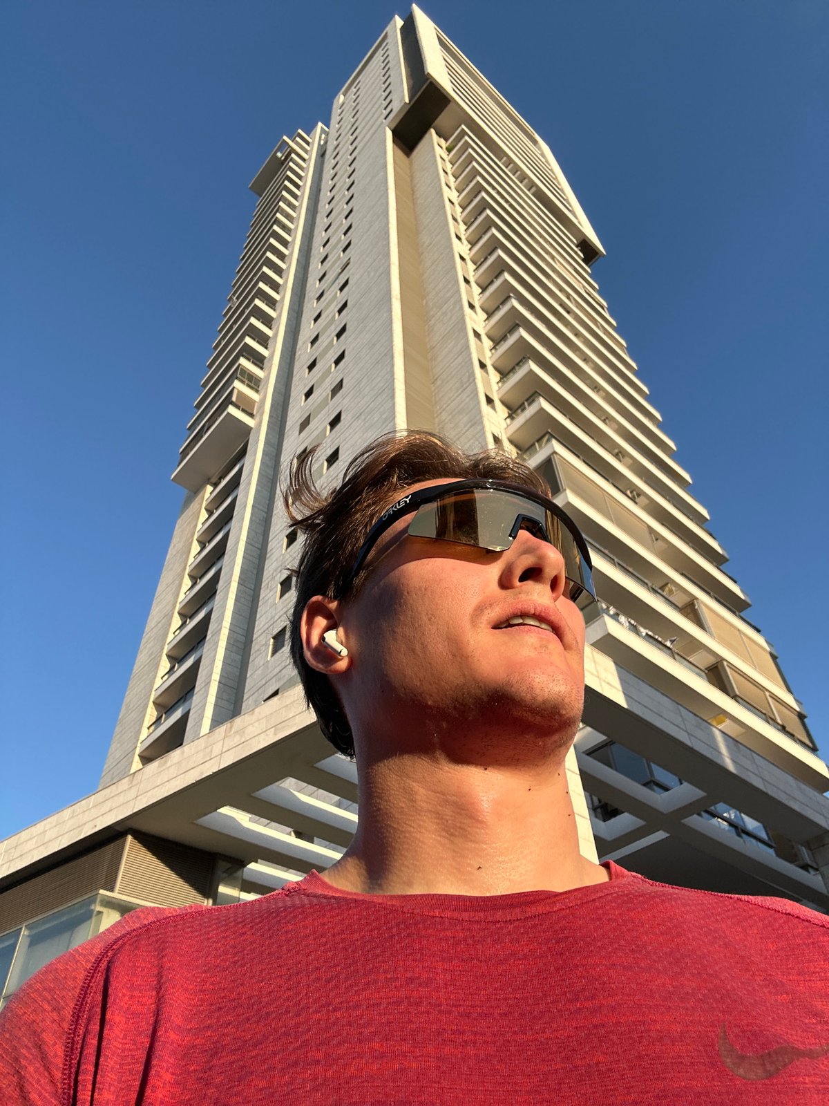 Man gazes up at building in Ramat Gan