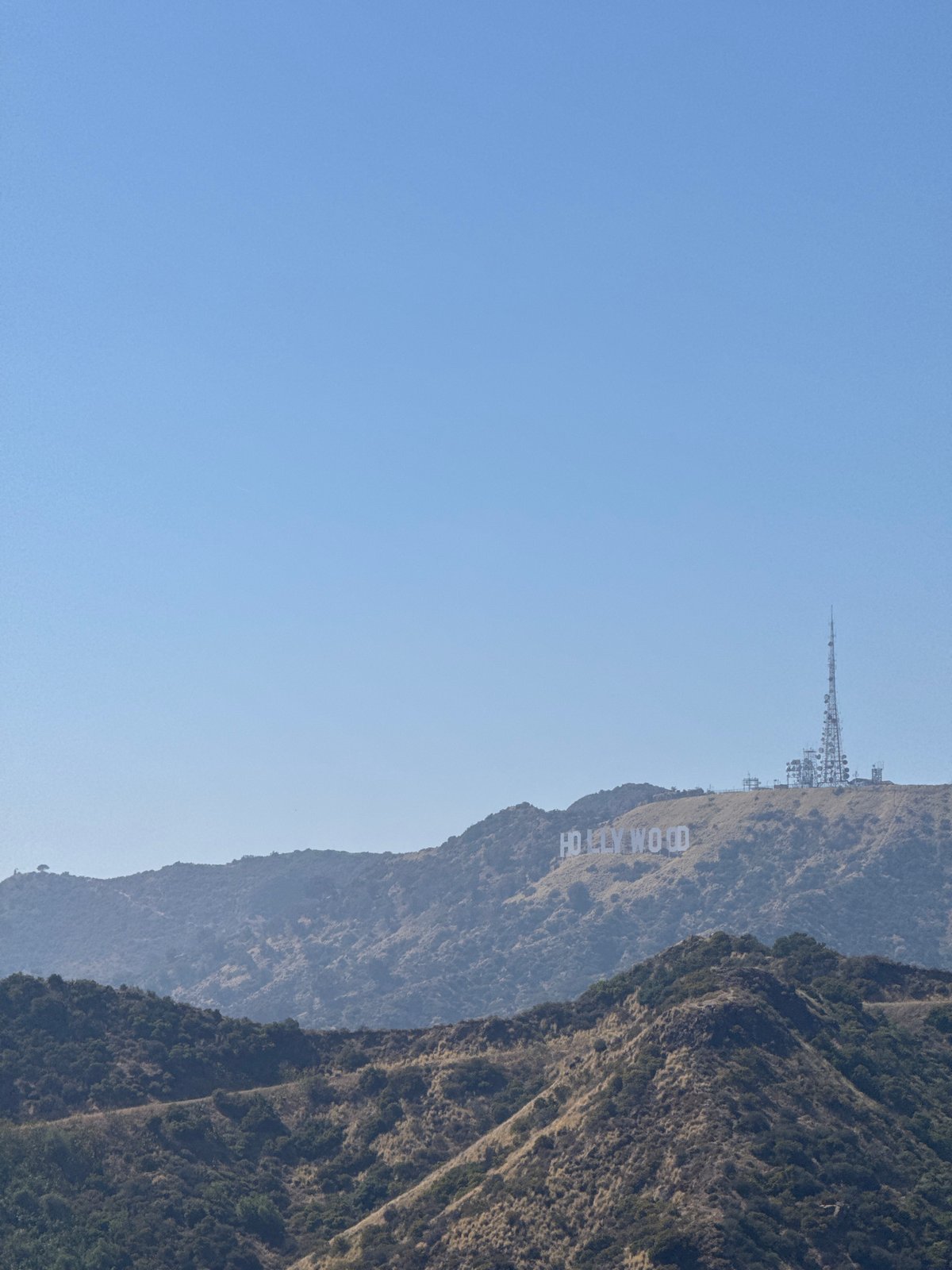 Tourist documents iconic LA landmarks during evening tour