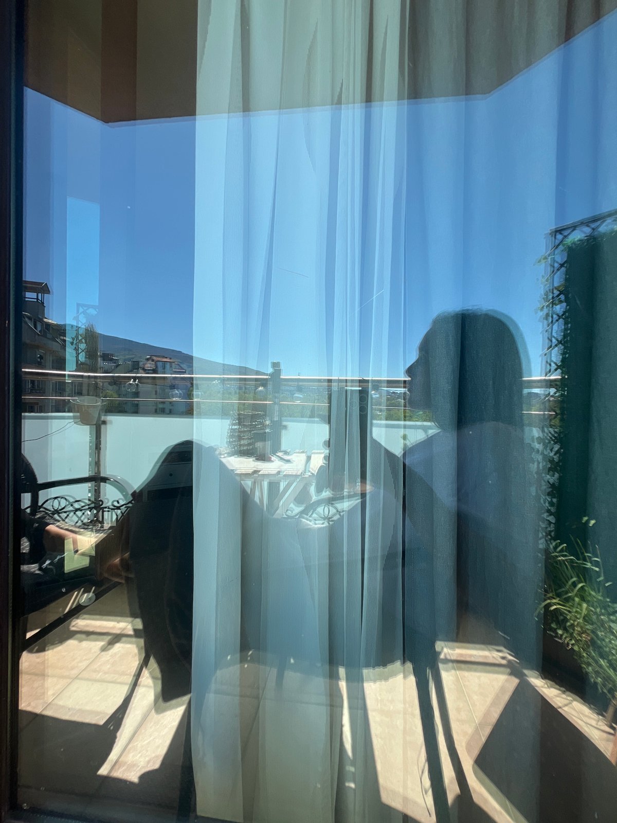 Window reflection and calm hashtag captured in Sofia