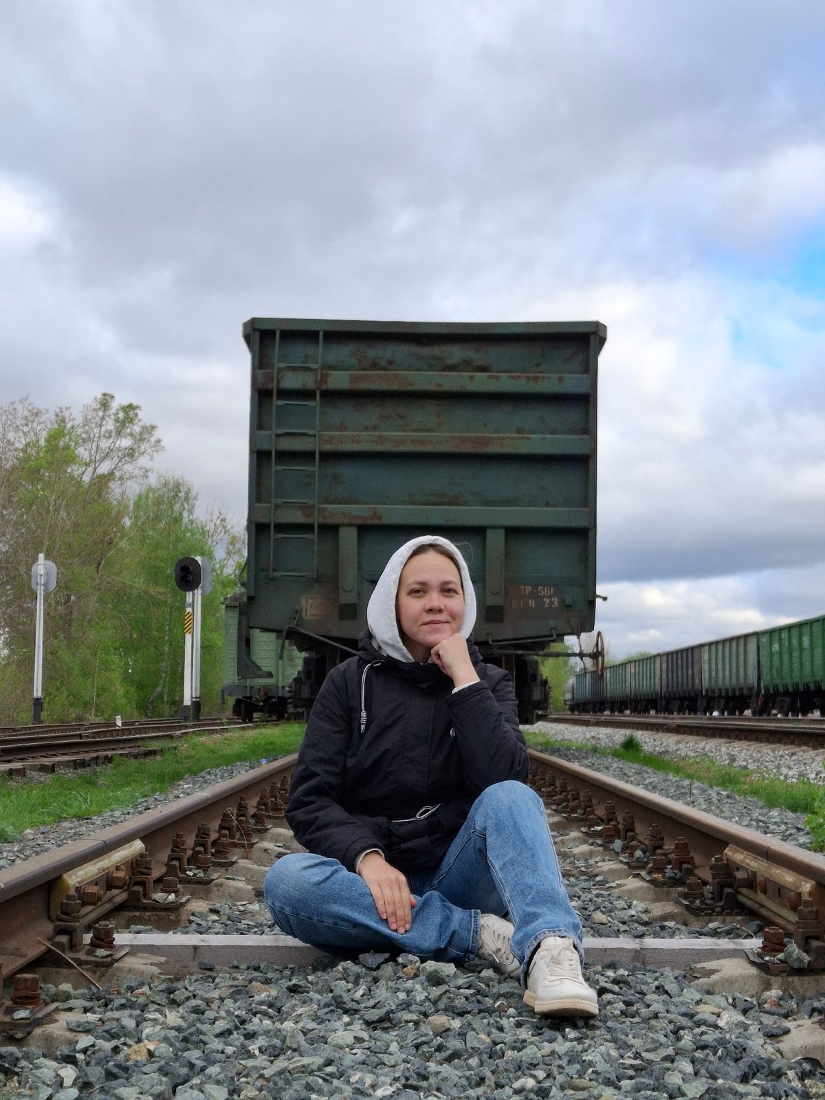 Person walks railroad tracks in Chaikovsky Russia early morning