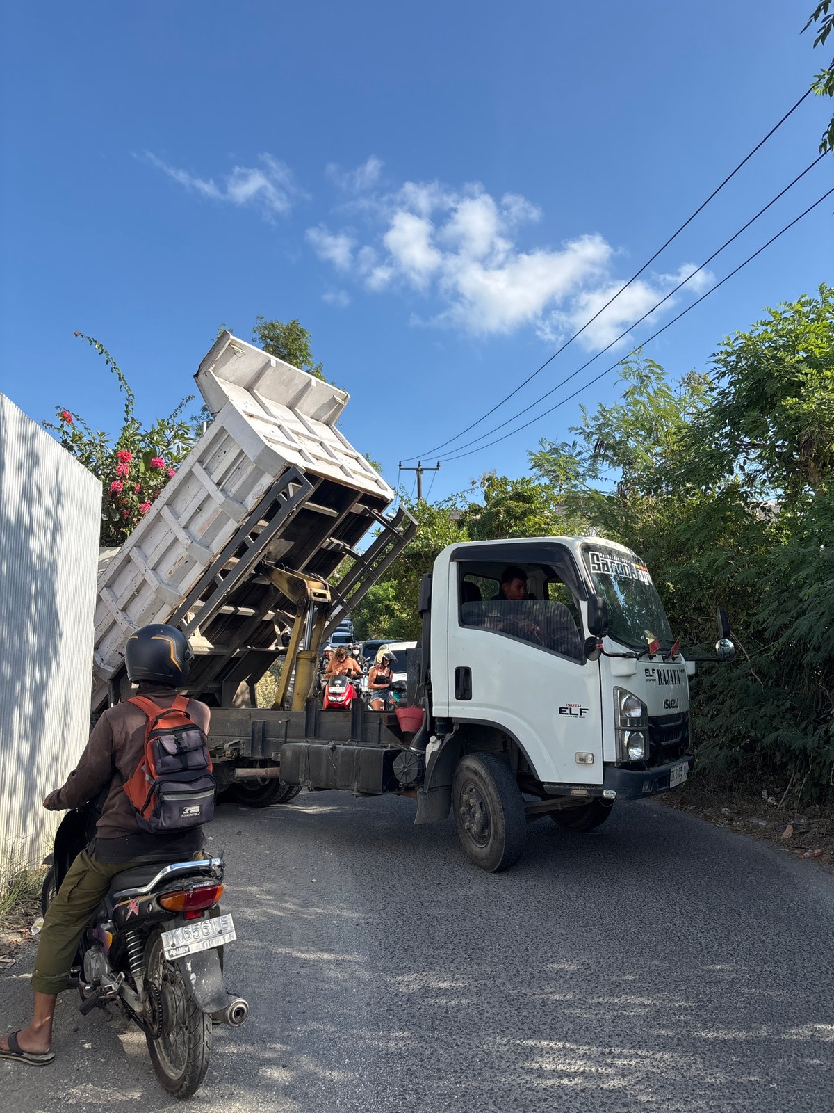 Dump truck blocks narrow road in Kuta Selatan, Bali