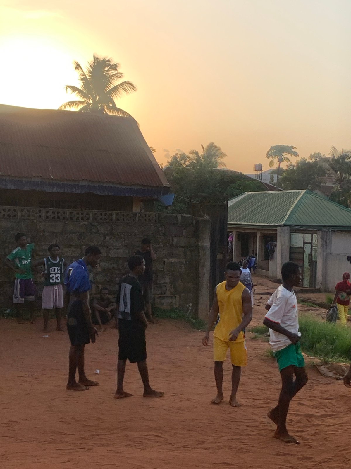 Young men play casual soccer in Nigerian village