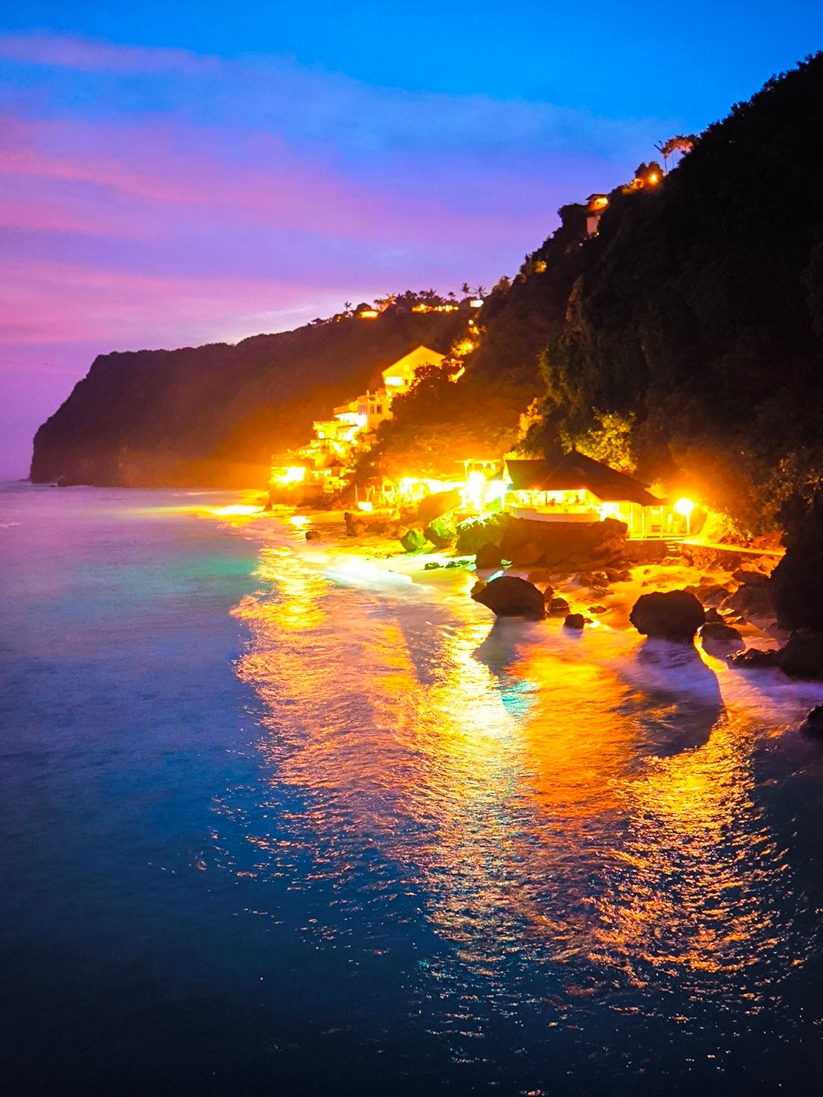 Coastal entertainment complex captured at twilight by witnesses