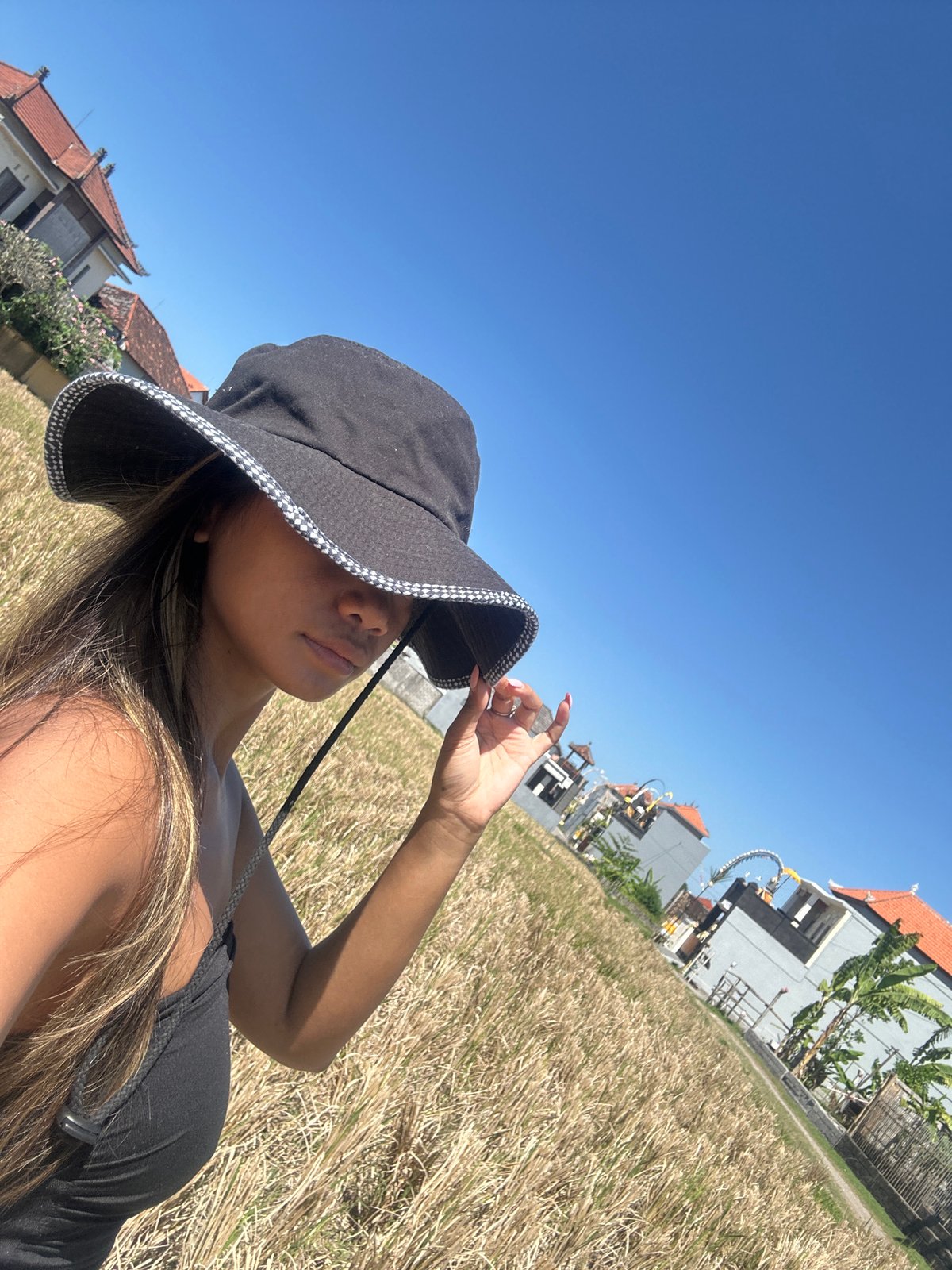 Hat selfies and a cat in Sukawati's golden rice fields
