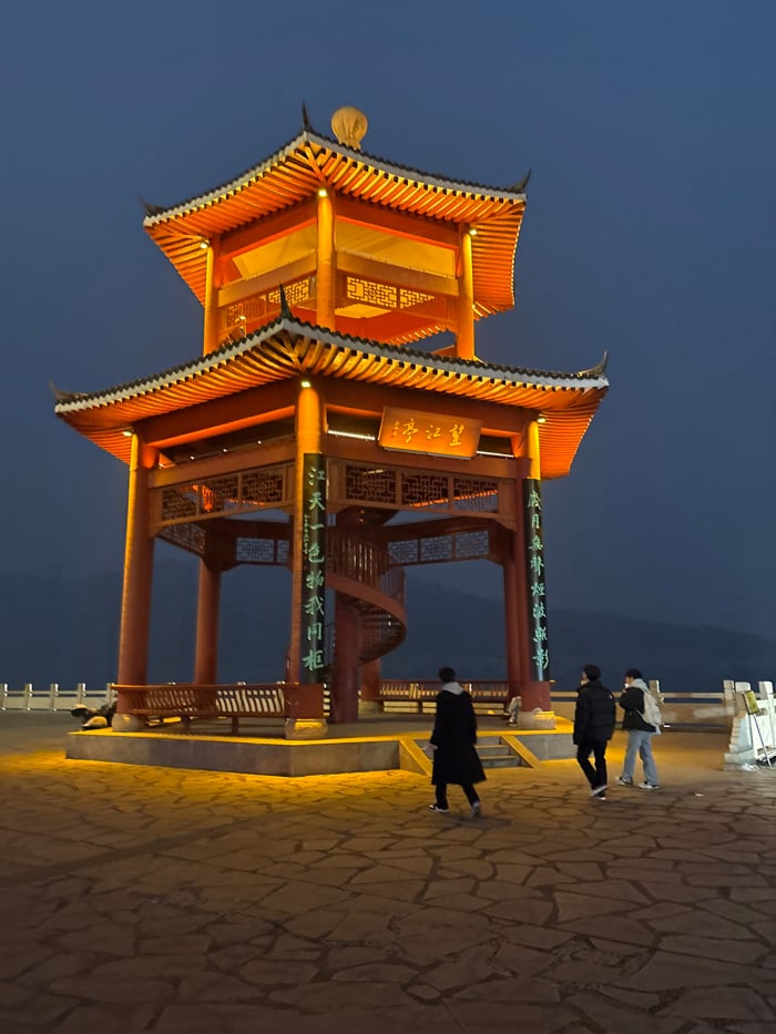 Group dancing and exercise activities at illuminated Jiangjin plaza
