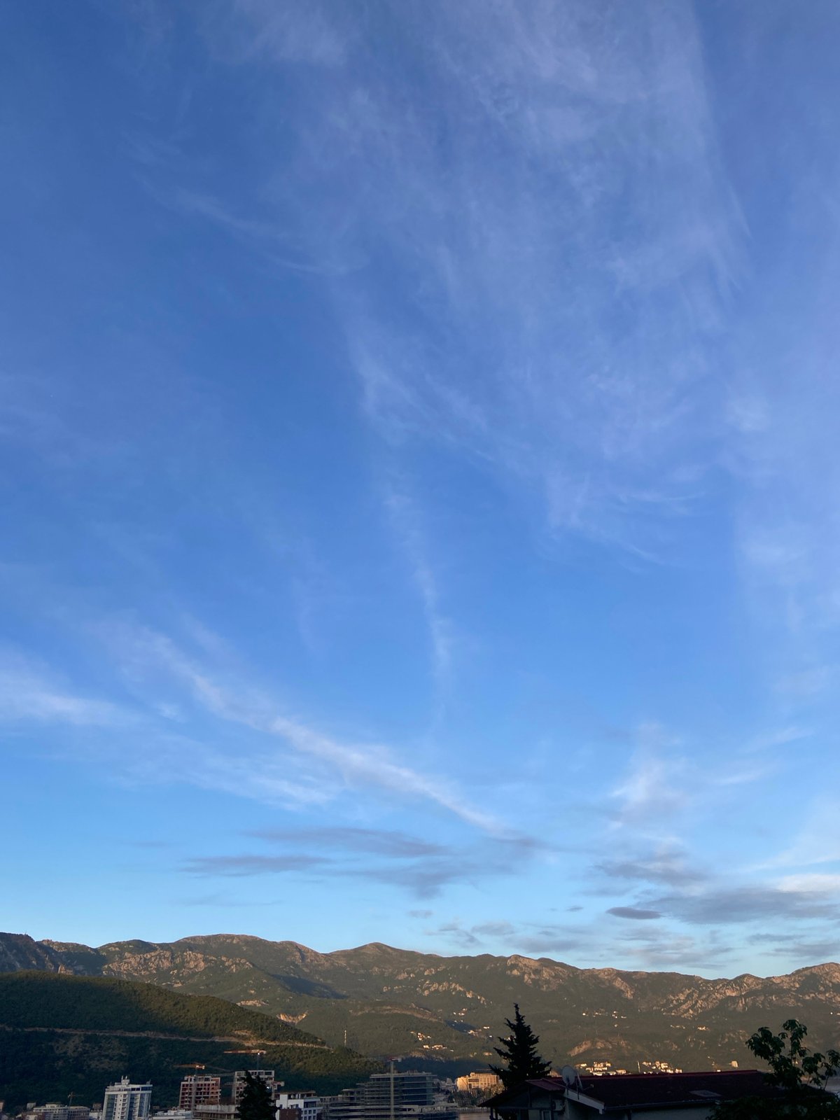 Witness documents mountain landscape with blue sky and clouds