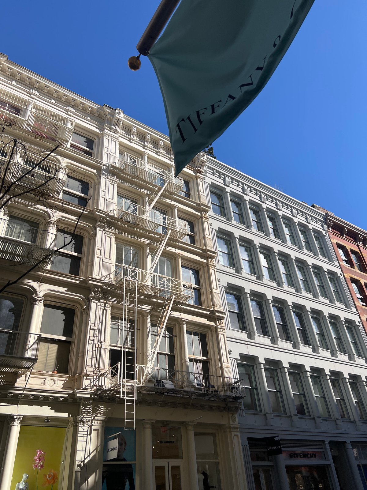Construction crew operates boom lift on NYC street