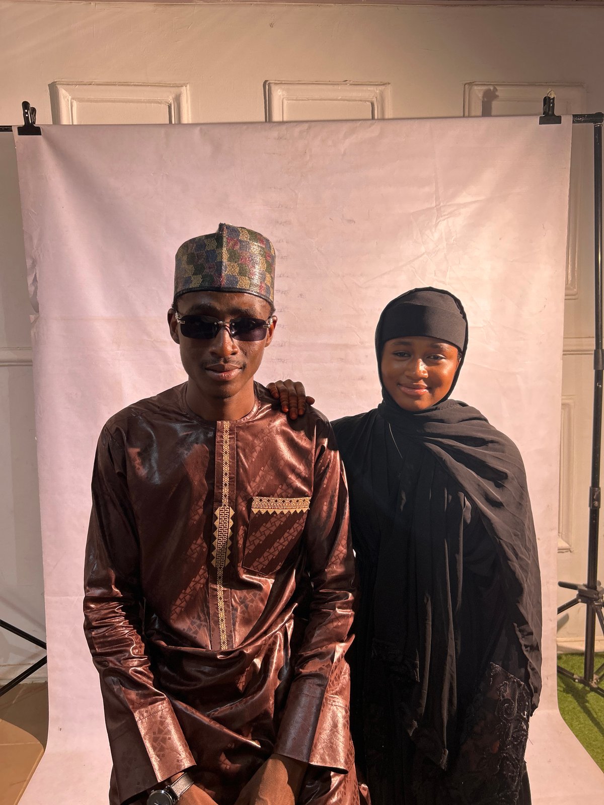 Portrait photography sessions documented at makeshift studio in Jos