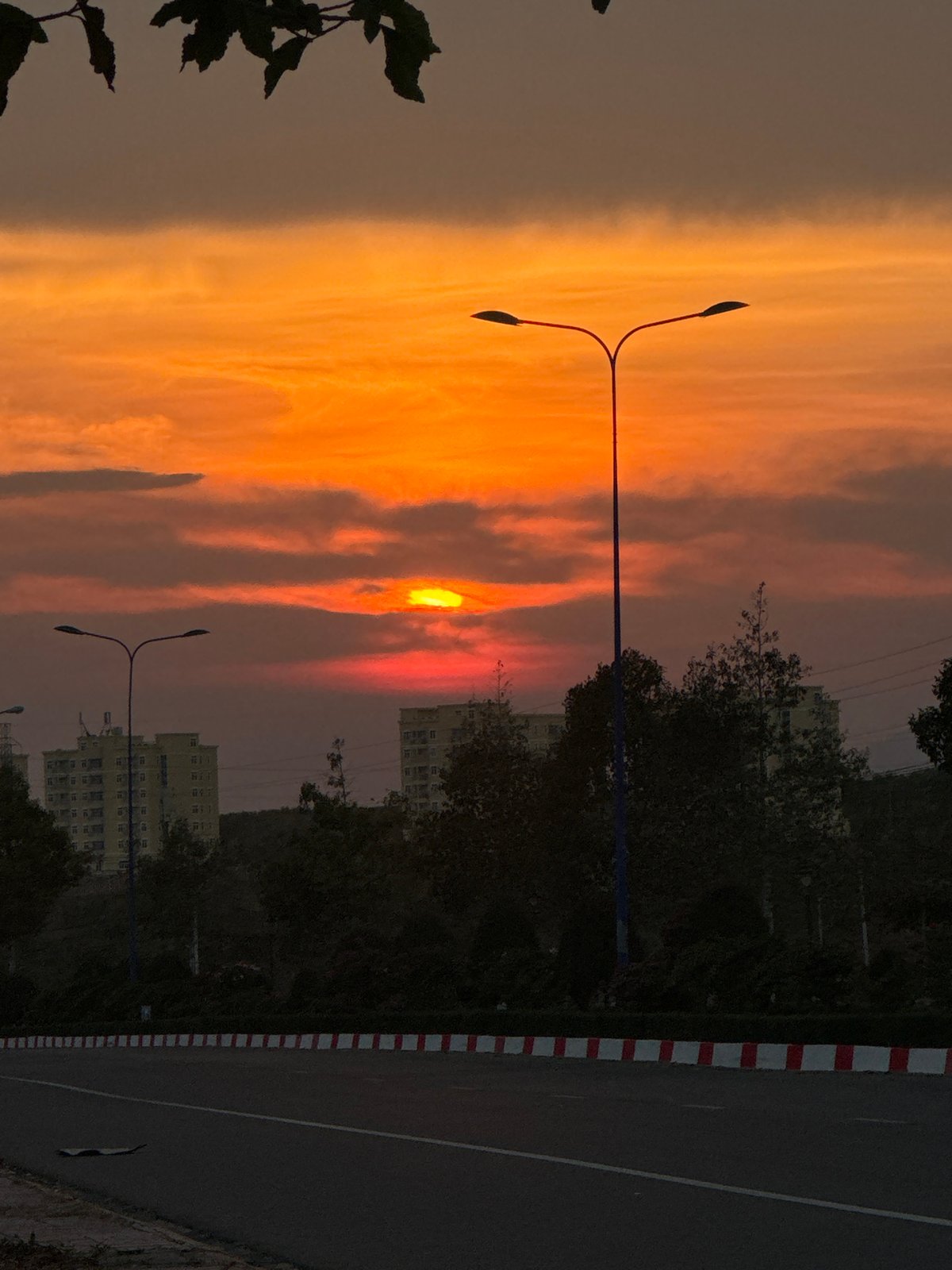 Orange sunset captured across Mui Ne Vietnam streets