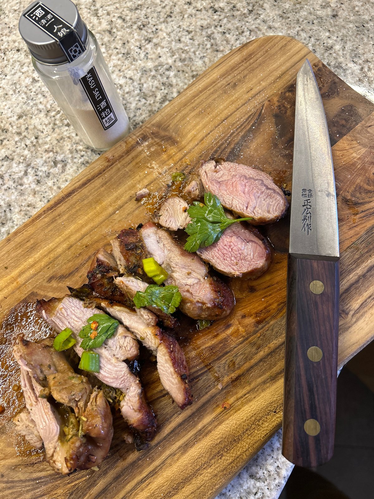 Home cook prepares seasoned meat in Riga kitchen