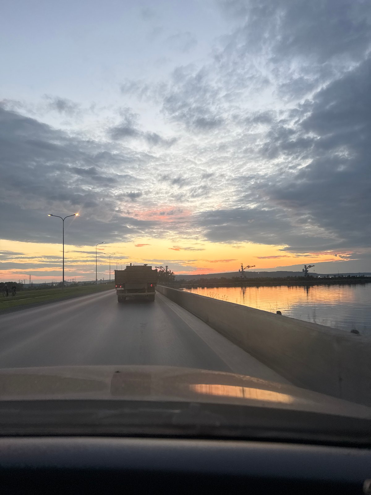 Woman documents sunset evening in Chaikovsky, Russia with flowers