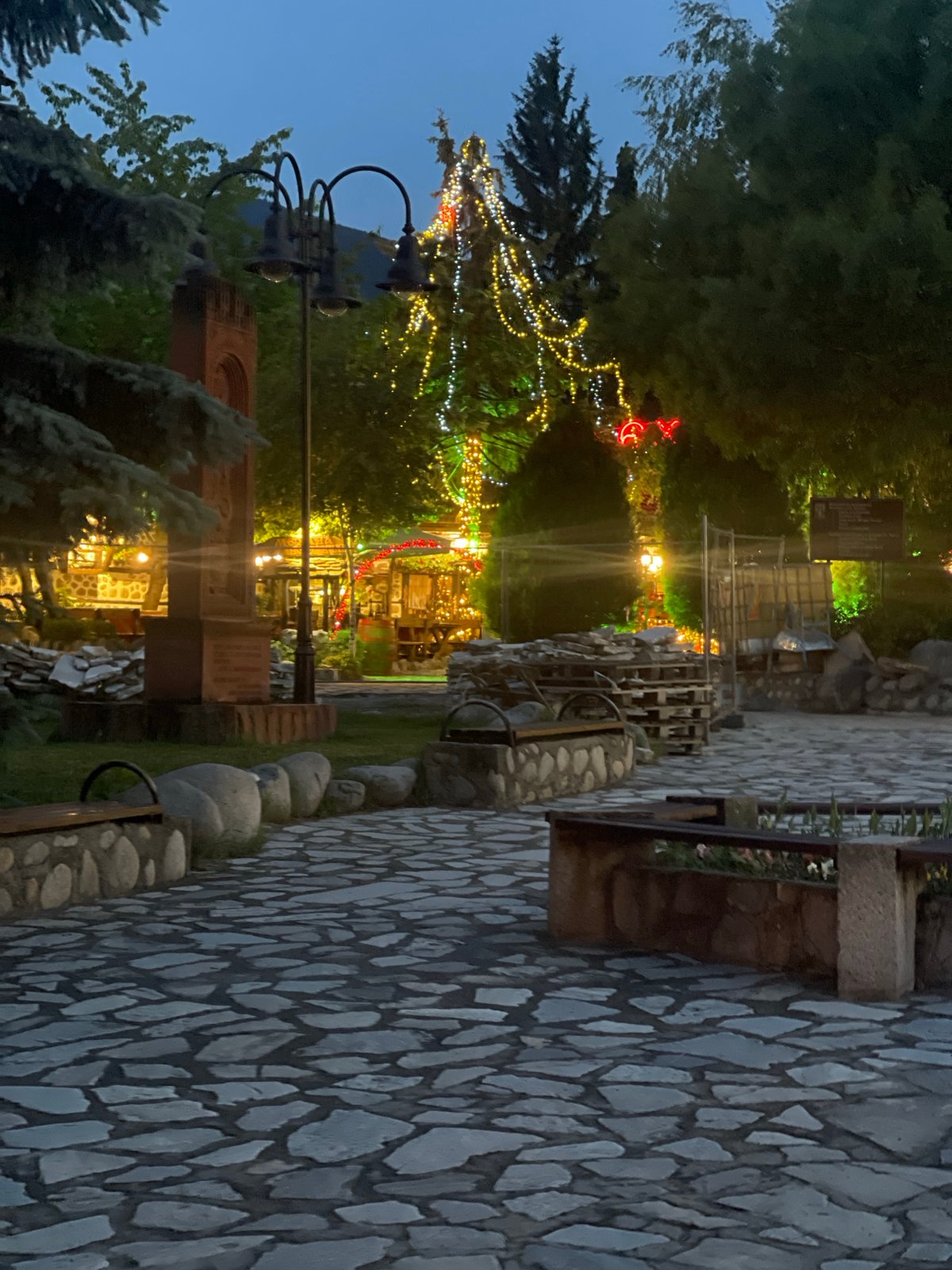 Evening illumination observed at outdoor dining establishment