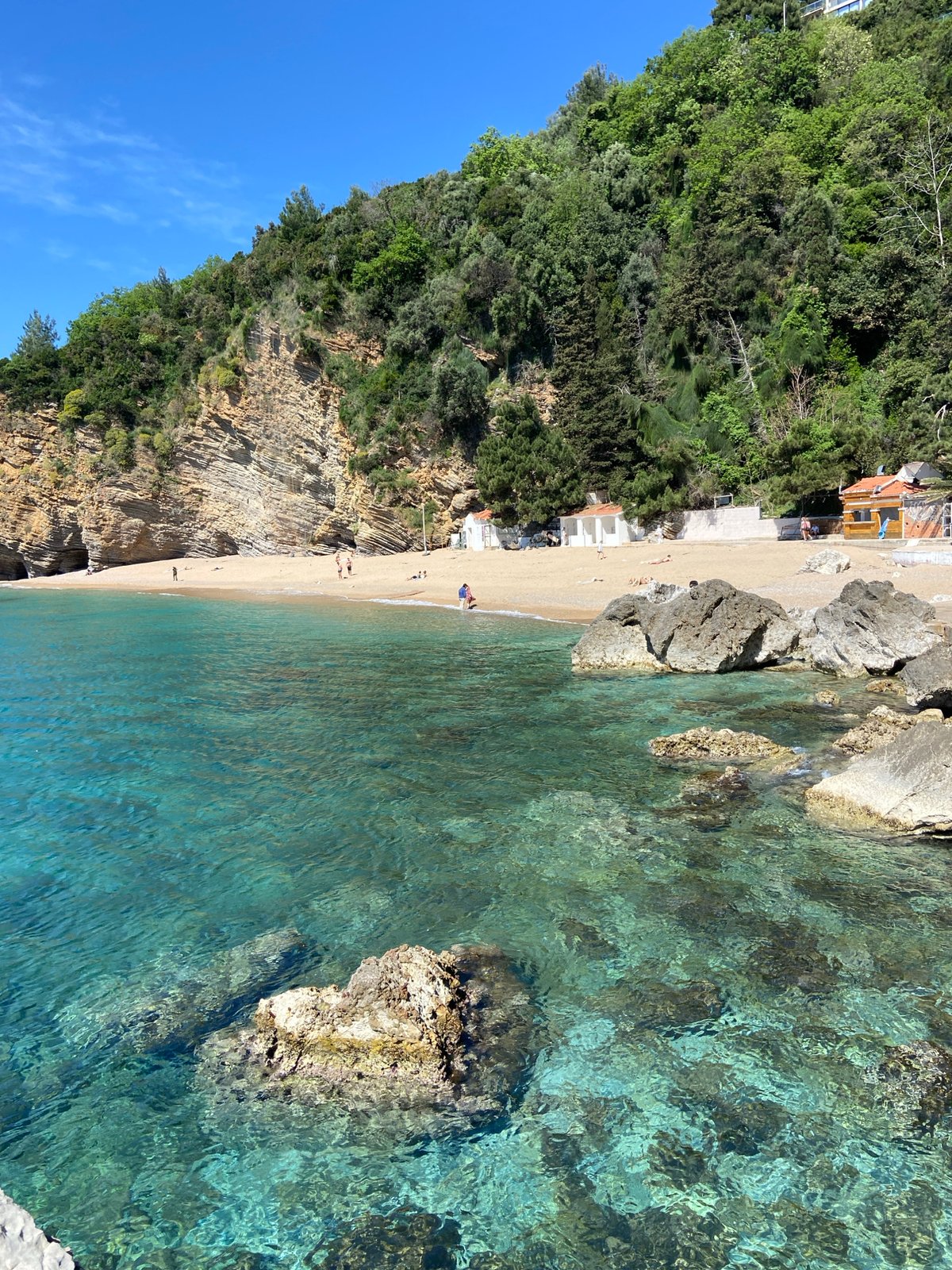 Aerial view captures pristine Budva beach cove in Montenegro