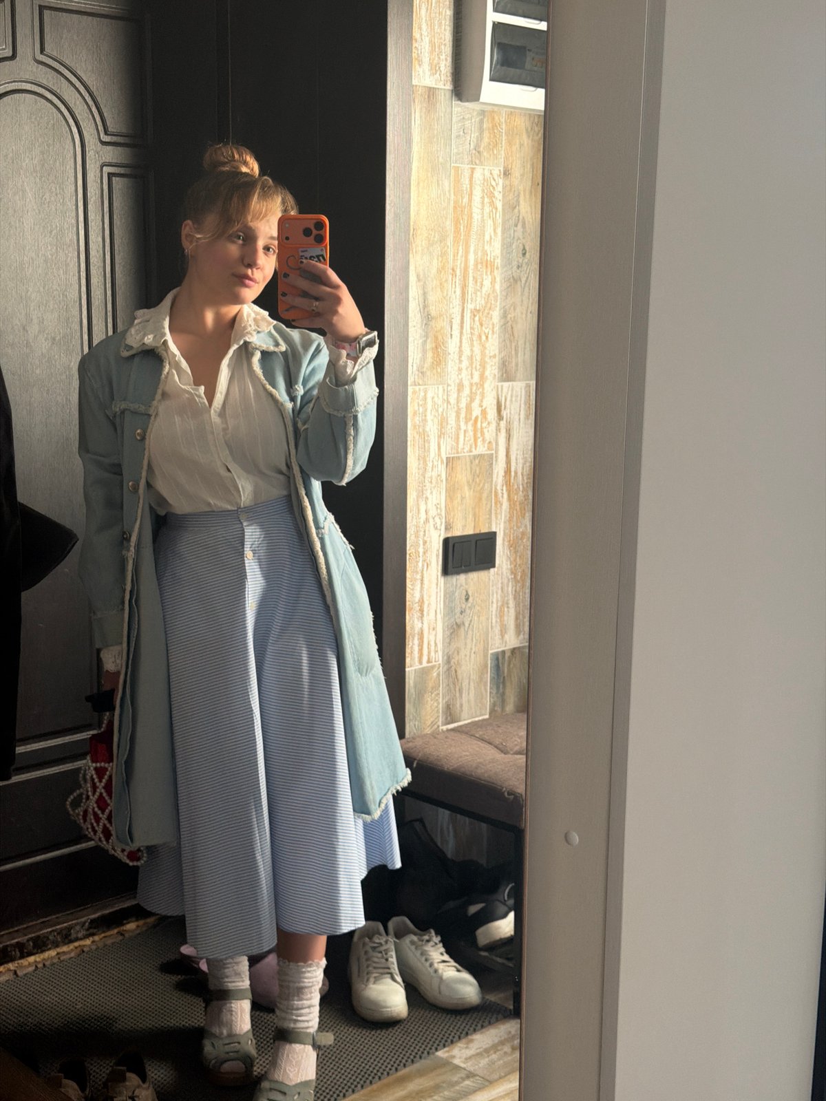 Woman takes multiple mirror selfies in Russian village