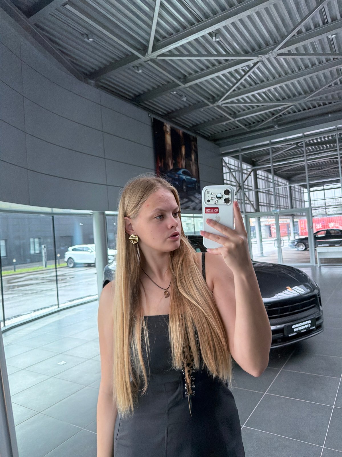Mirror selfies and Porsche Macans at an Izhevsk dealership