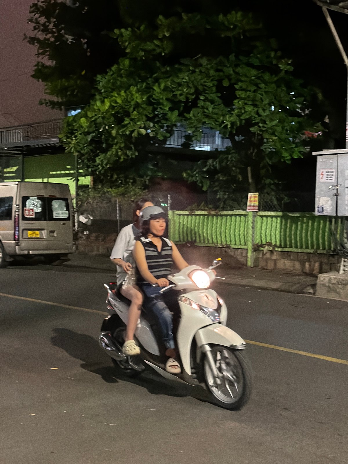 Nha Trang streets at night: motorbikes, bougainvillea, and city life