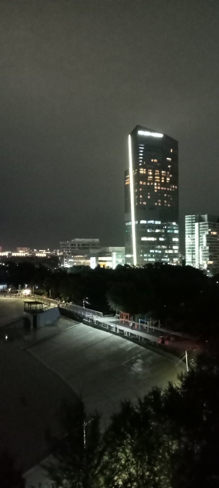 Almaty after dark: skyline, ski jumps, and waterfront lights