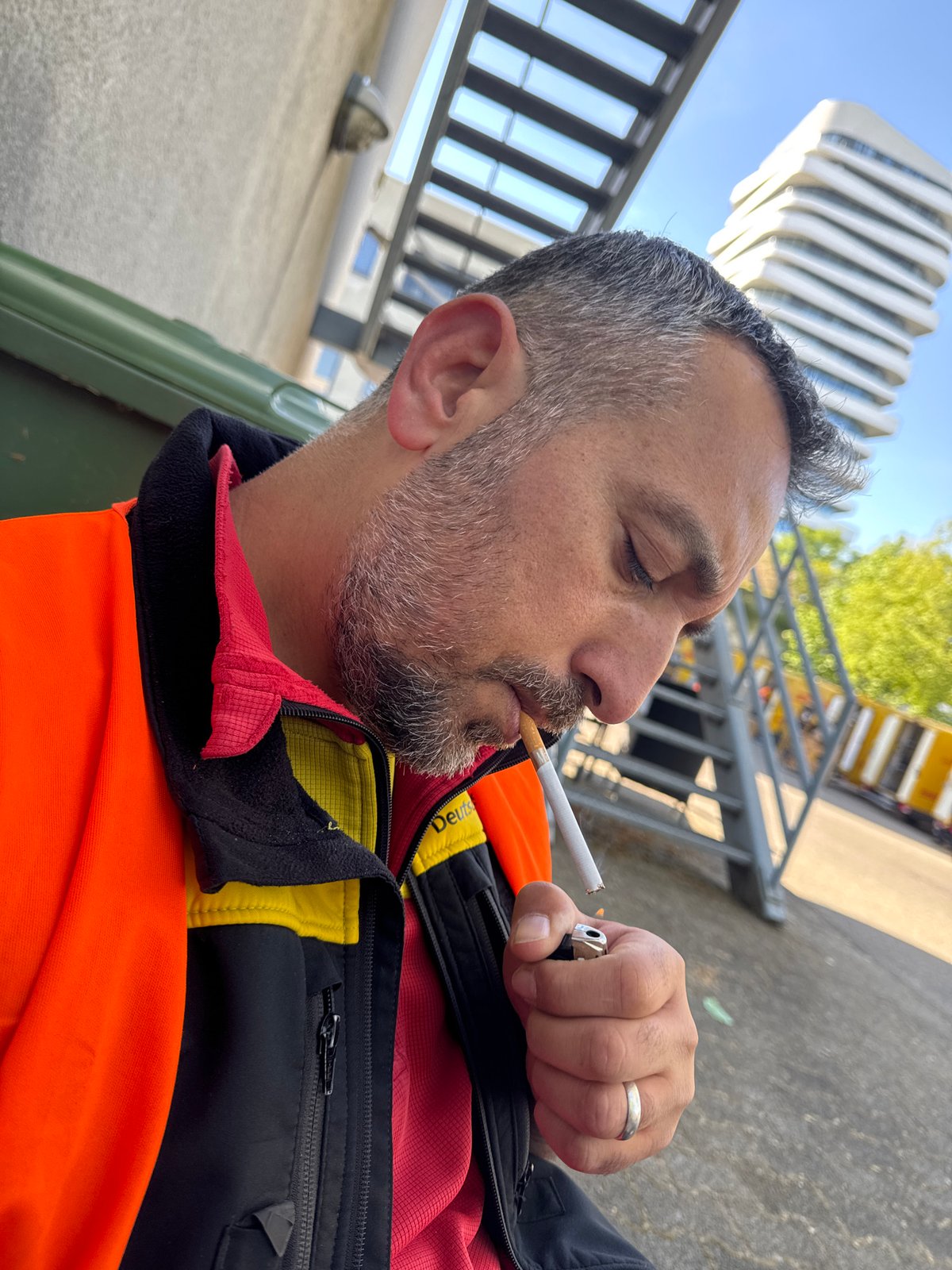 Man lights cigarette outdoors in Bietigheim-Bissingen, Germany