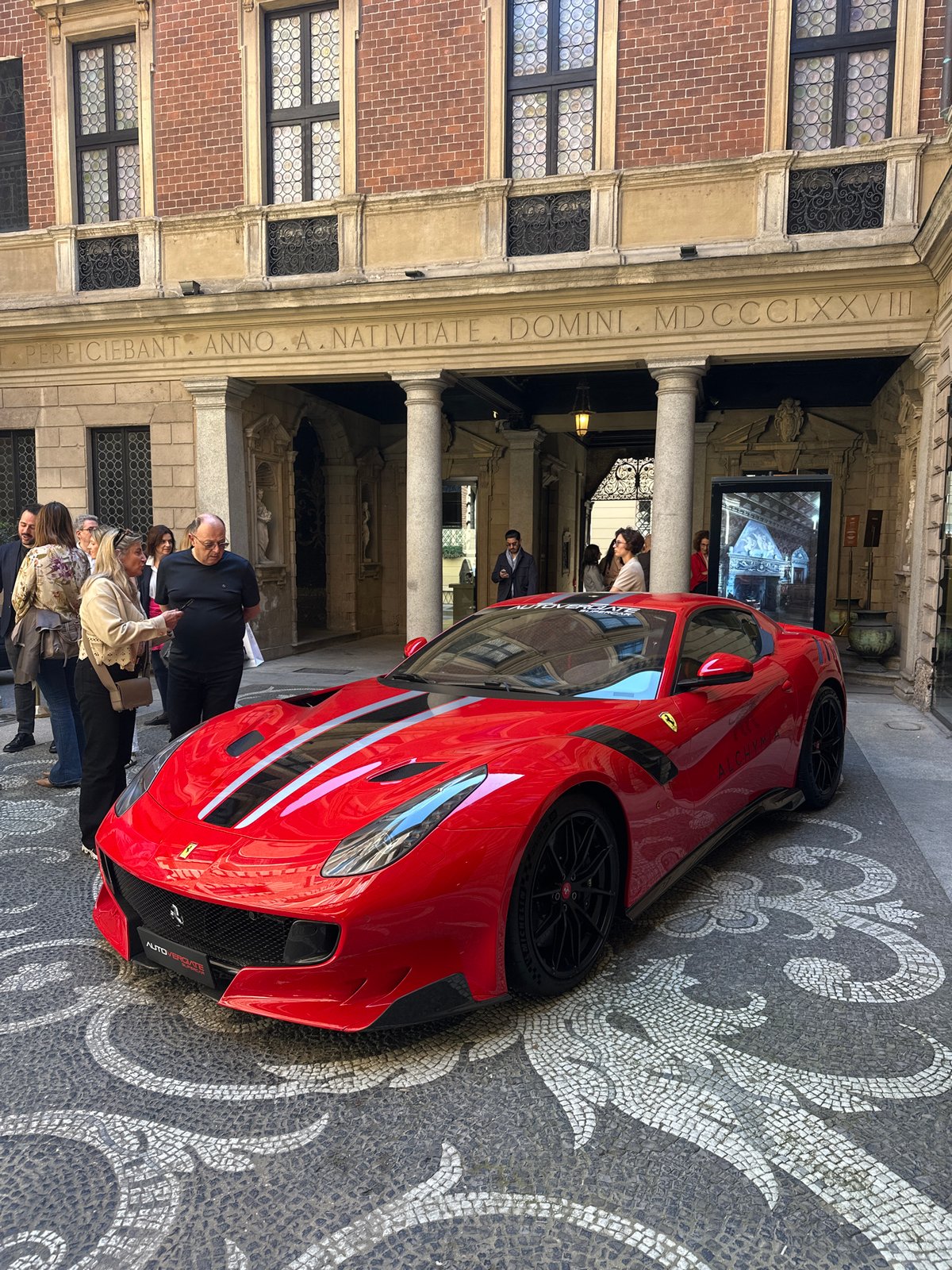 Red Ferrari spotted at historic Milan building