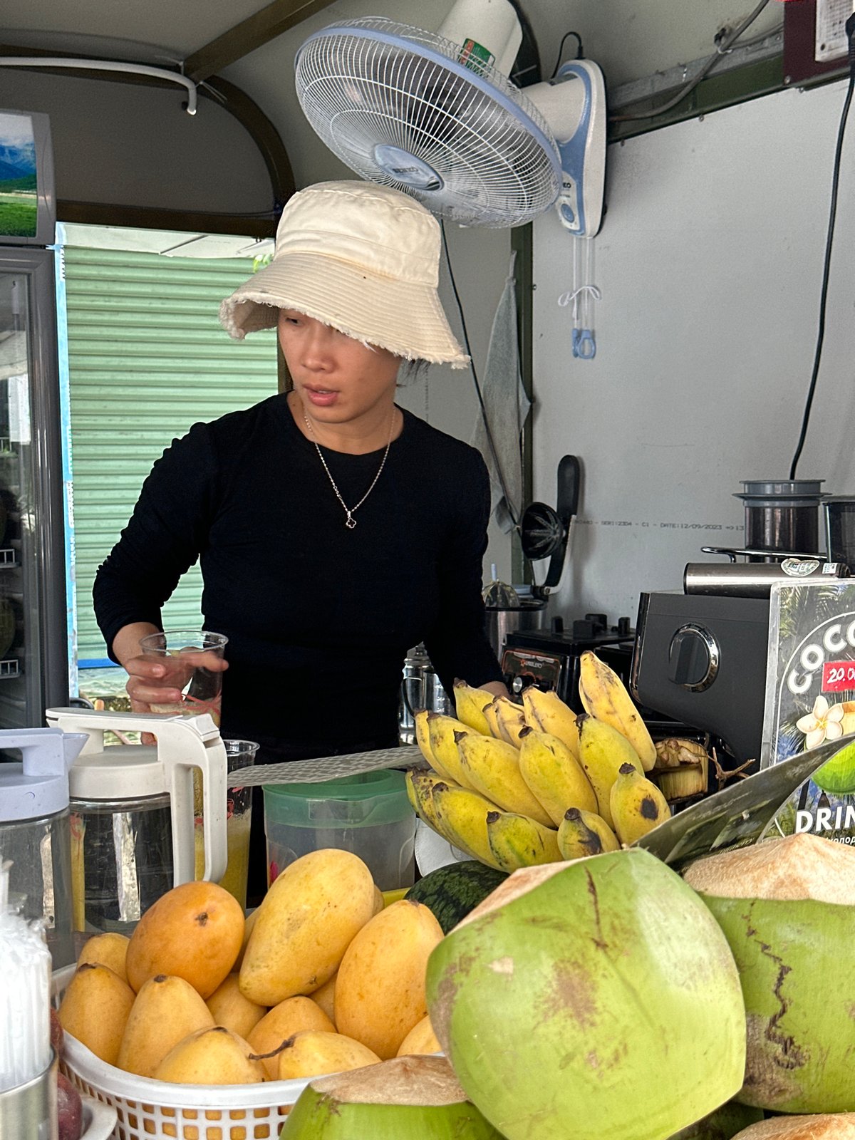 Fresh coconut stall doing business in Phu Thuy Ward, Vietnam