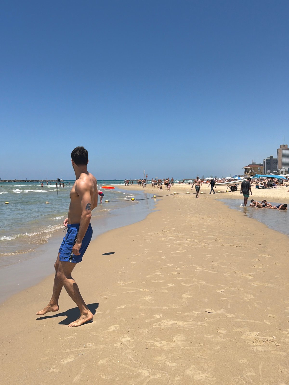 Tel Aviv beachgoers enjoy soccer under sunny skies