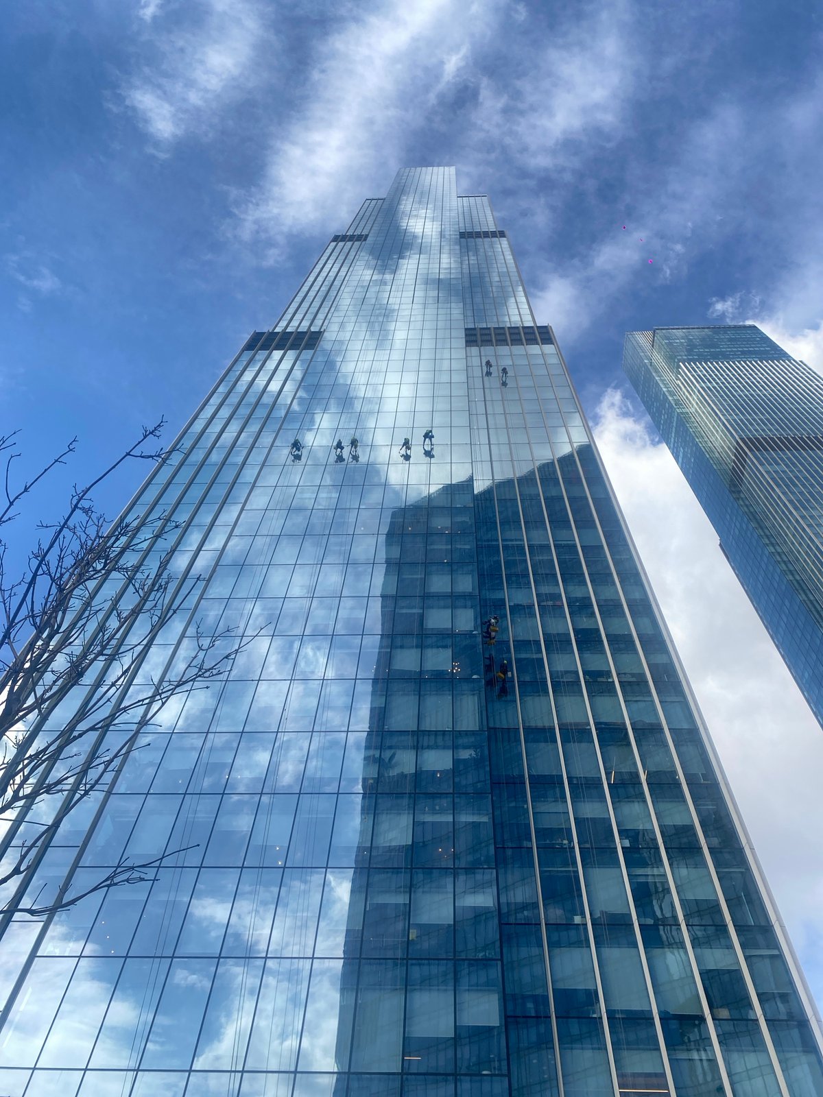 Window washers clean skyscraper facade in Khimki, Russia